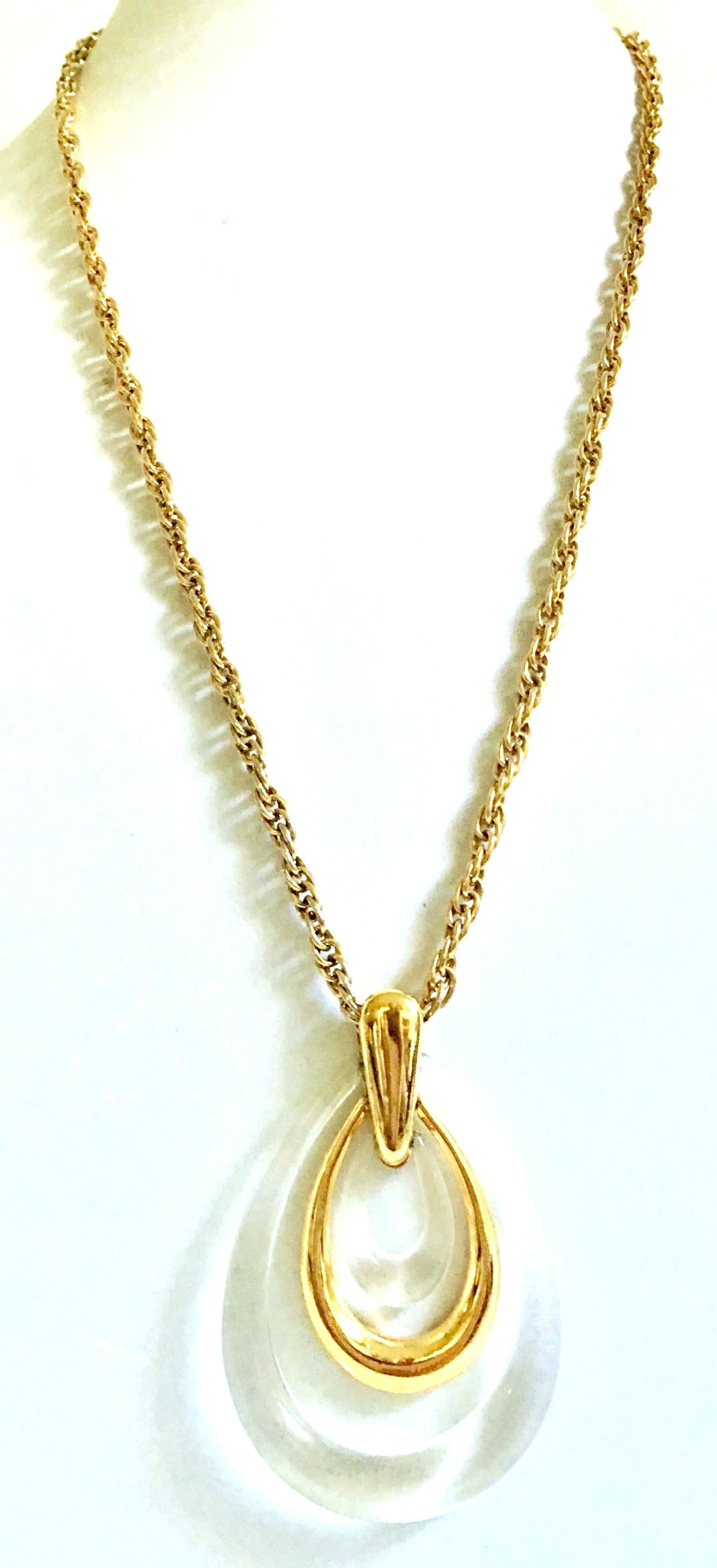 20th Century Crown Trifari Gold & Translucent Lucite Articulating Teardrop Pendant Necklace. This Trifari signed piece features a gold plate chain with a 3.13