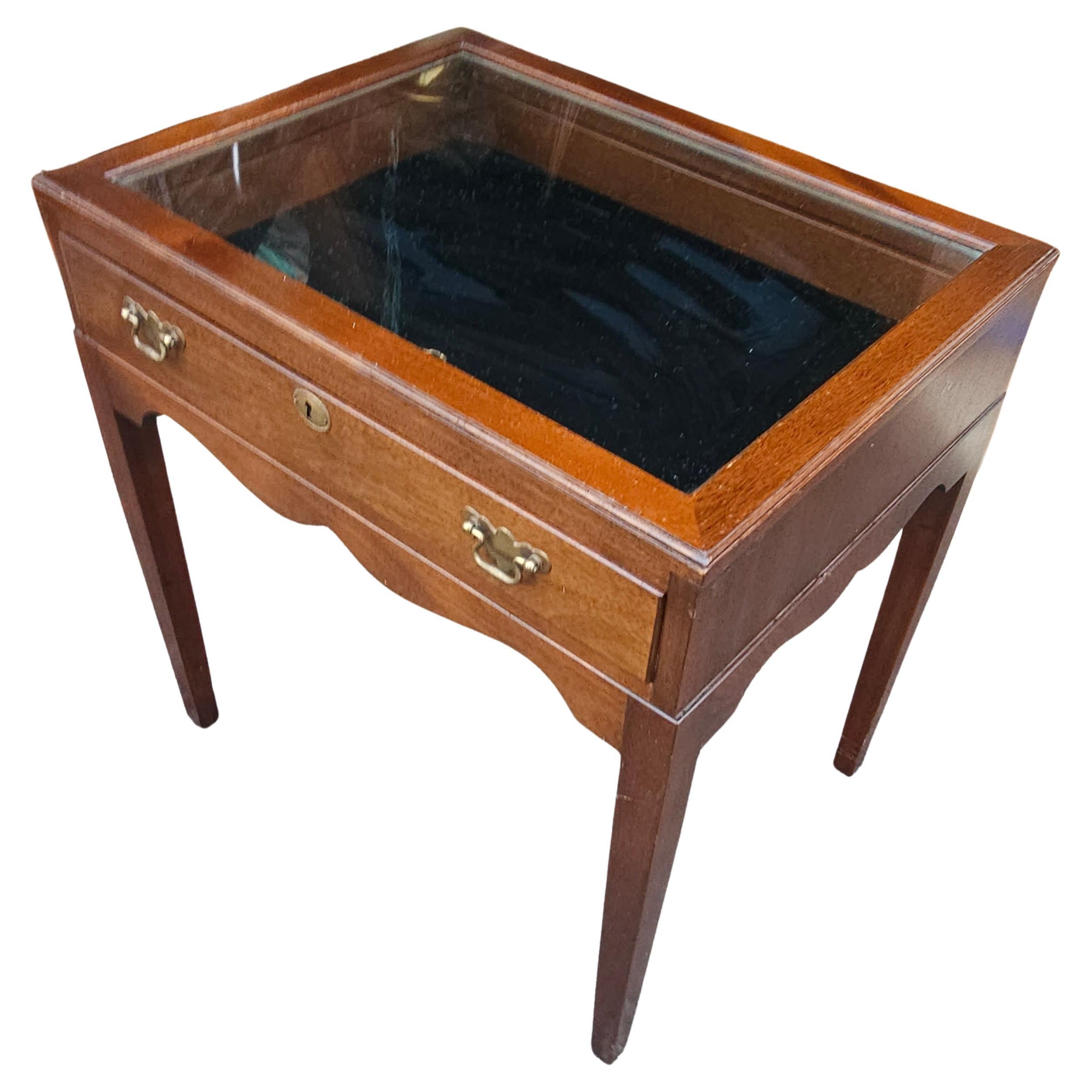 A 20th Century Mahogany and Glass Top Display Table with black velvet lining and Lock. One key present. Measures 25.75