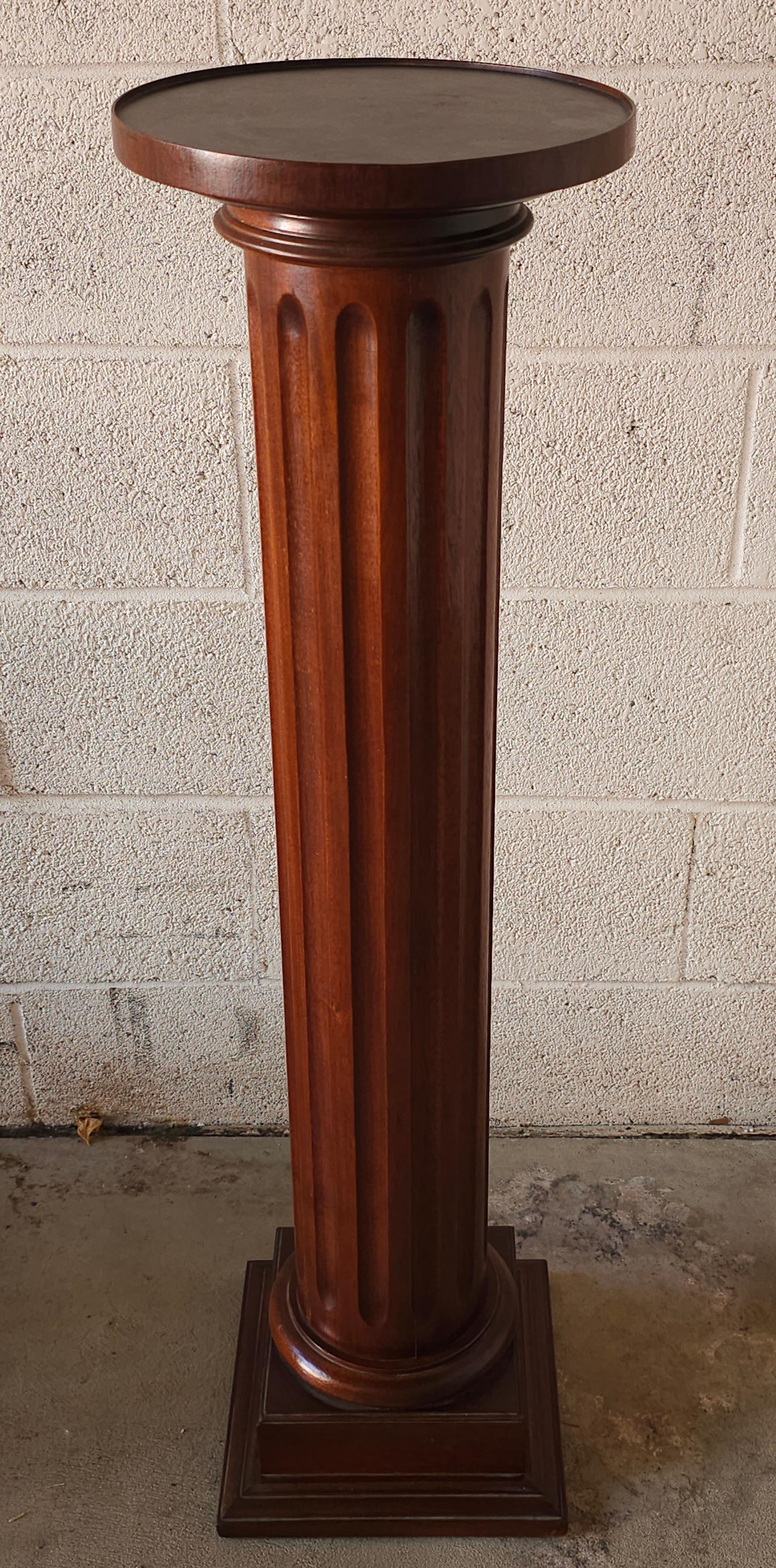 A 20th Century Mahogany Ionic Order Style Column-Form Pedestal
 Measures 10.5