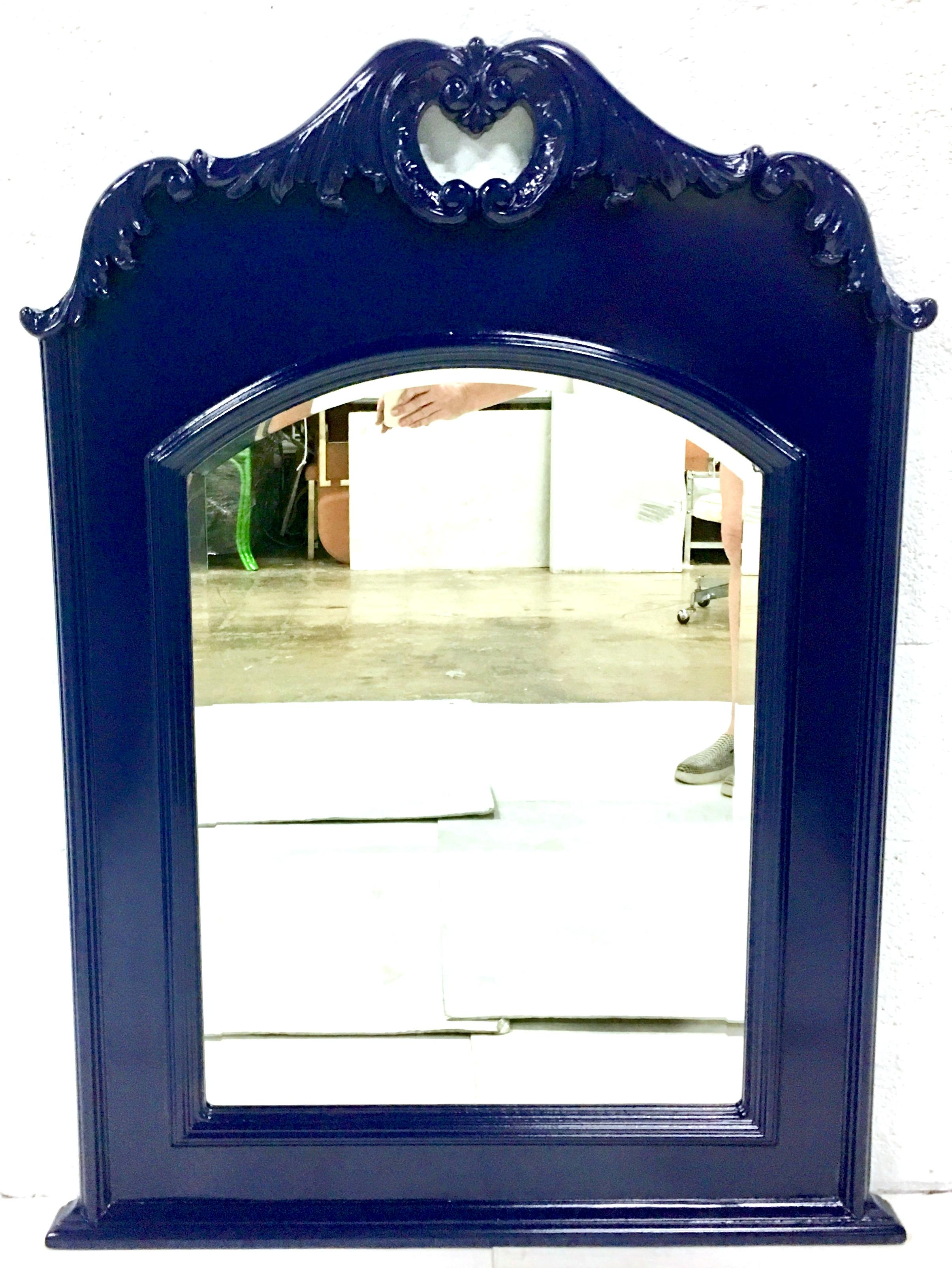 Vintage carved mahogany lacquered Federal blue cartouche acanthus beveled edge
wall mirror. This solid mahogany, heavy duty mirror has been newly and professionally spray lacquered in high gloss vibrant Federal blue. Mirror features a beveled edge