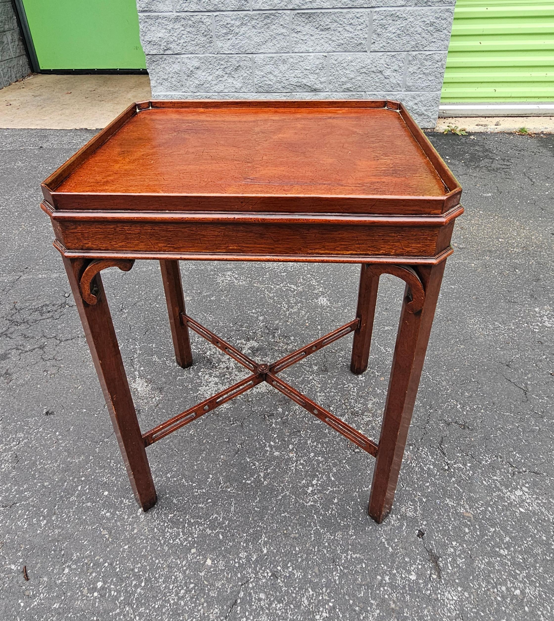 A 20th Century Mahogany with cross Stretcher leg support with solid Gallery top Side Table. Measures 19