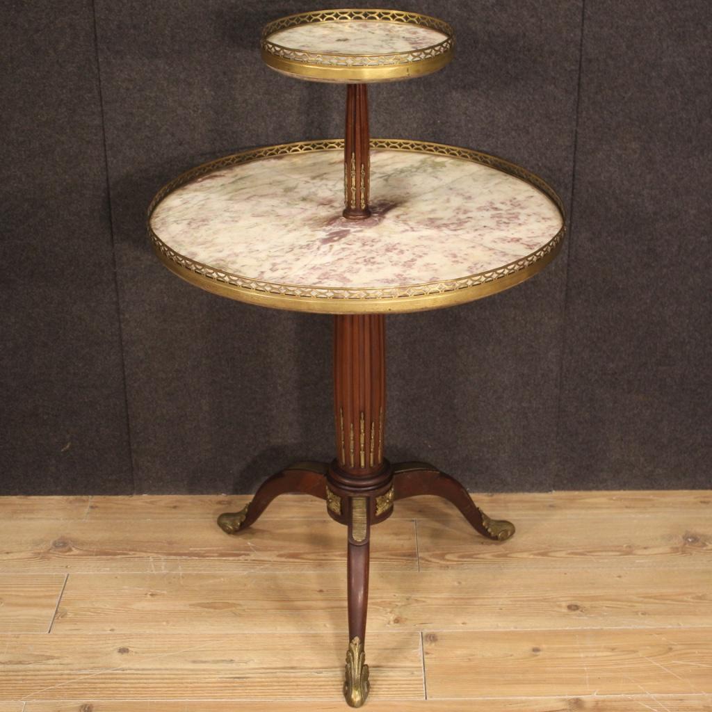 French étagère furniture from the early 20th century. Side table carved in mahogany wood richly adorned with gilded and chiseled bronze and brass. Furniture complete with two shelves with recessed marble and brass ring of good size and service.