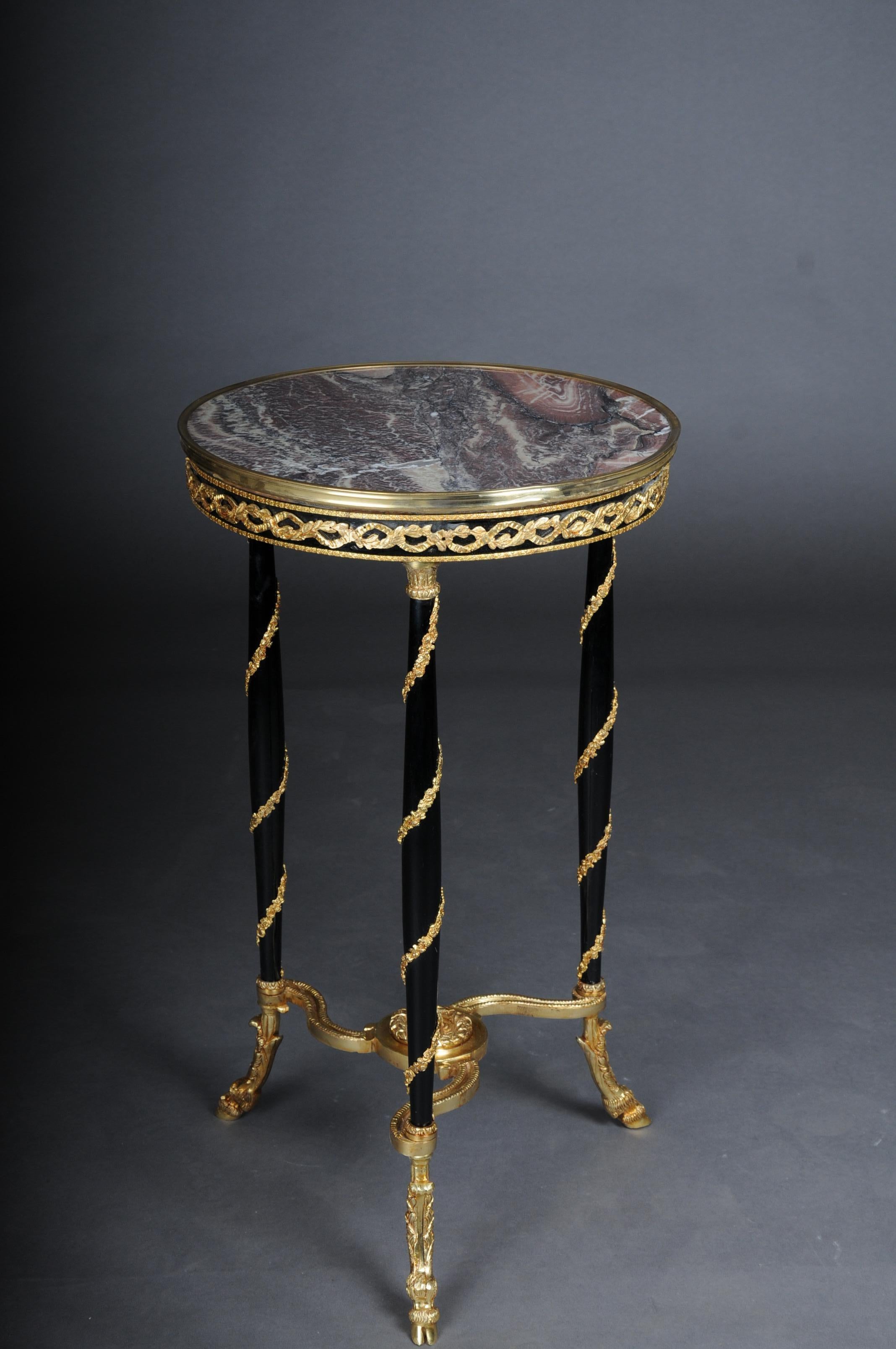 20th Century Majestic Empire side table/Gueridon Beechwood, Marble, Round,Black

Solid beech wood painted black with gilded brass bronze. Top plate with brass-framed marble top.
Elegant full column legs wrapped with gilded brass fittings.