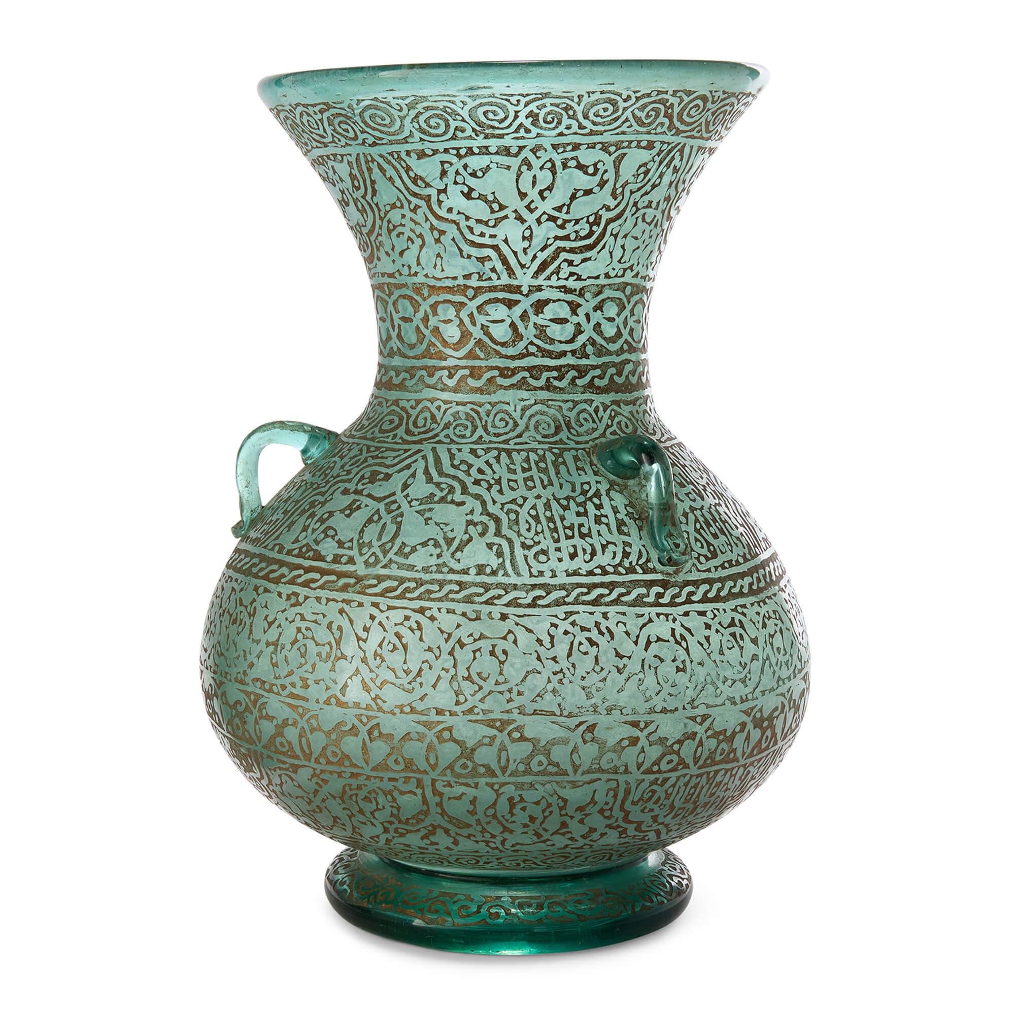 20th Century Mamluk Style Green Glass Gold Gilded Mosque Lamp
French, 20th Century 
Height 30cm, diameter 22cm

This mosque lamp reflects the centuries-old tradition of illuminating sacred spaces in Islamic architecture. Blown glass lamps such as