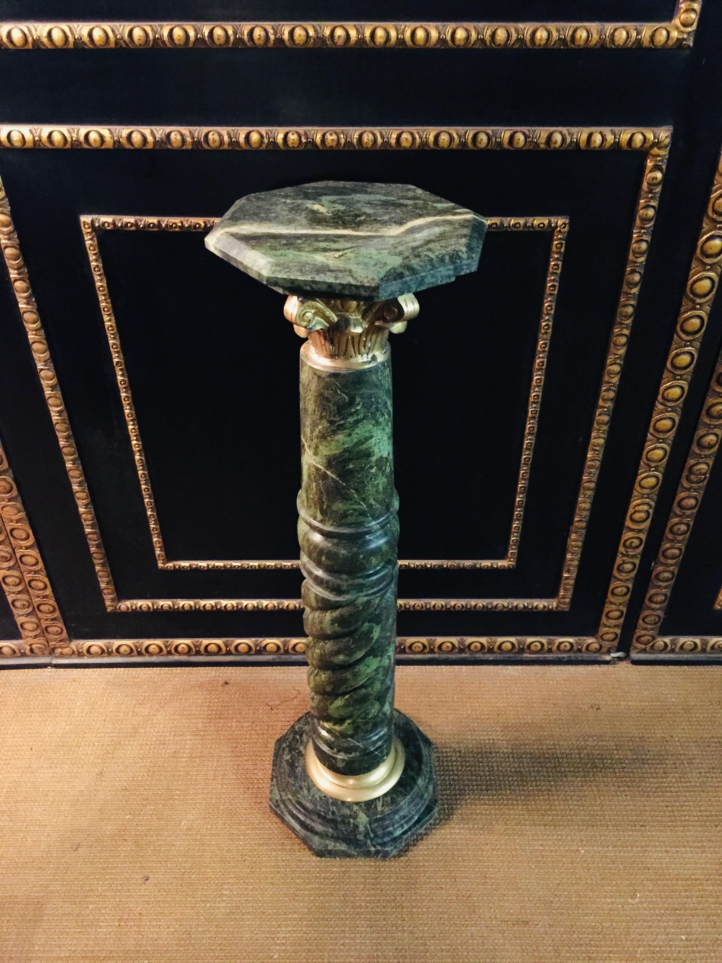 20th century marble pillar/column in Louis XV style green marble with bronze bases and capitals. Rectangular, profiled cover plate. Partially turned column shaft extremely decorative.
  