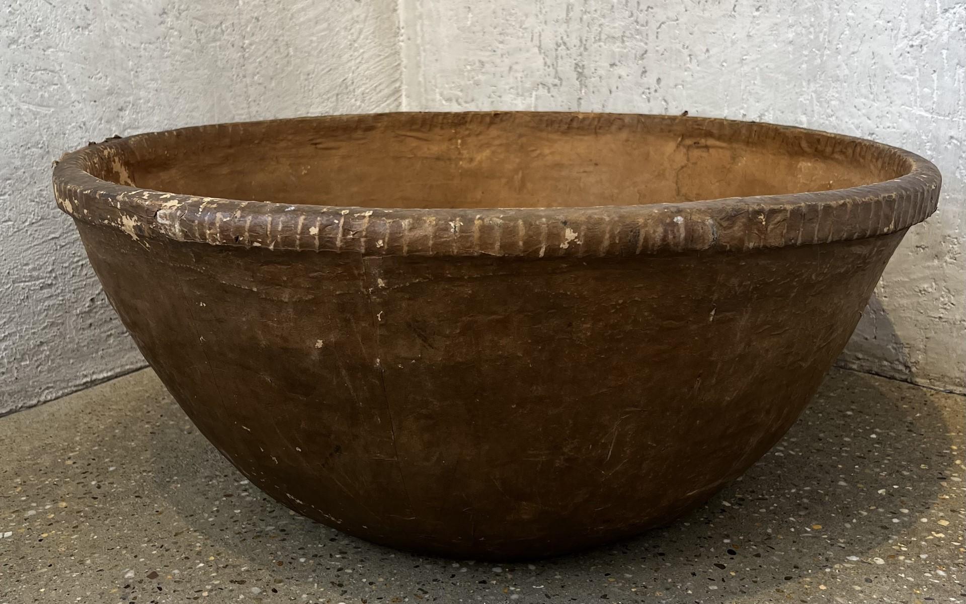 The scale of this papermache bowl is unusual and spectacular. The color, stitching, and scale make this an object d’ art. 
Three pieces available.