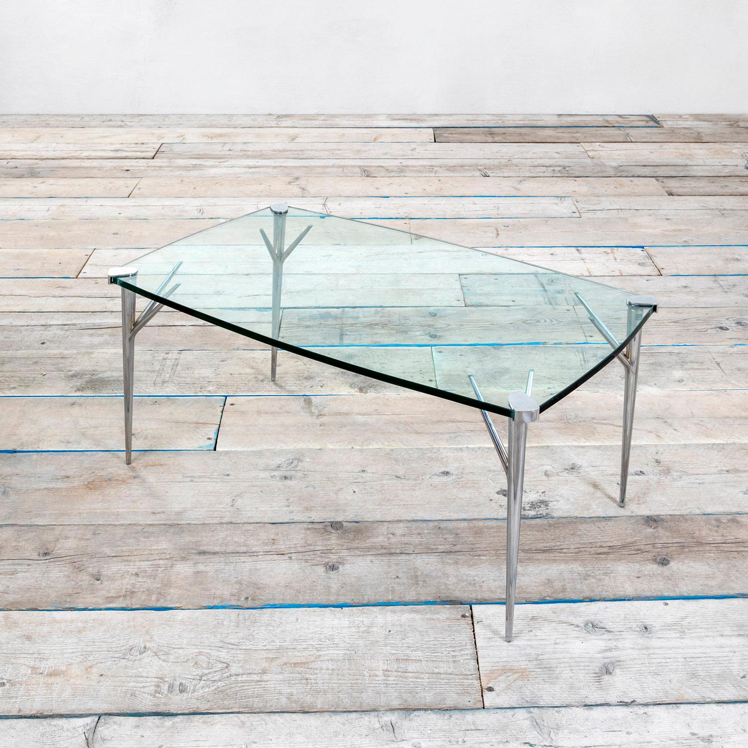 Low table or coffee table designed by Max Ingrand in the half of 1950s for Fontana Arte. The table has 4 peculiar feet in polished brass and the top in ground glass. 
Very good condition, patina of time, original in all its parts. 
Presence of the