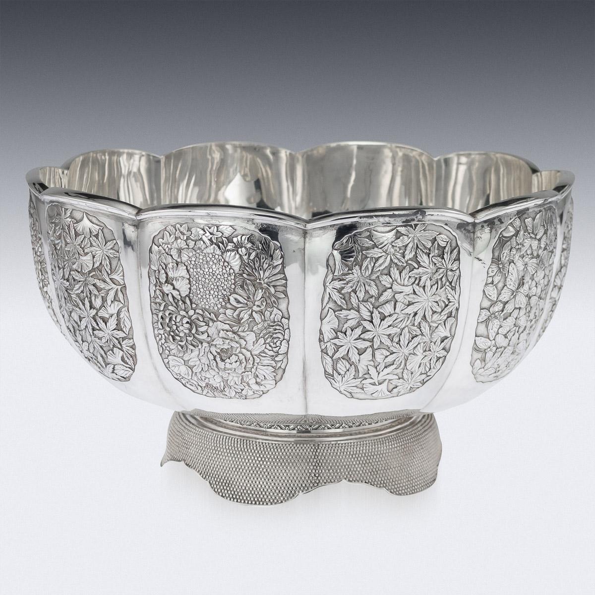 Antique early 20th century Japanese Meiji period solid silver bowl, double walled, ten panels densely chased with blossoming chrysanthemums, Japanese maple leaves and butterflies on matted hand hammered ground, shaped floral rim and standing on a
