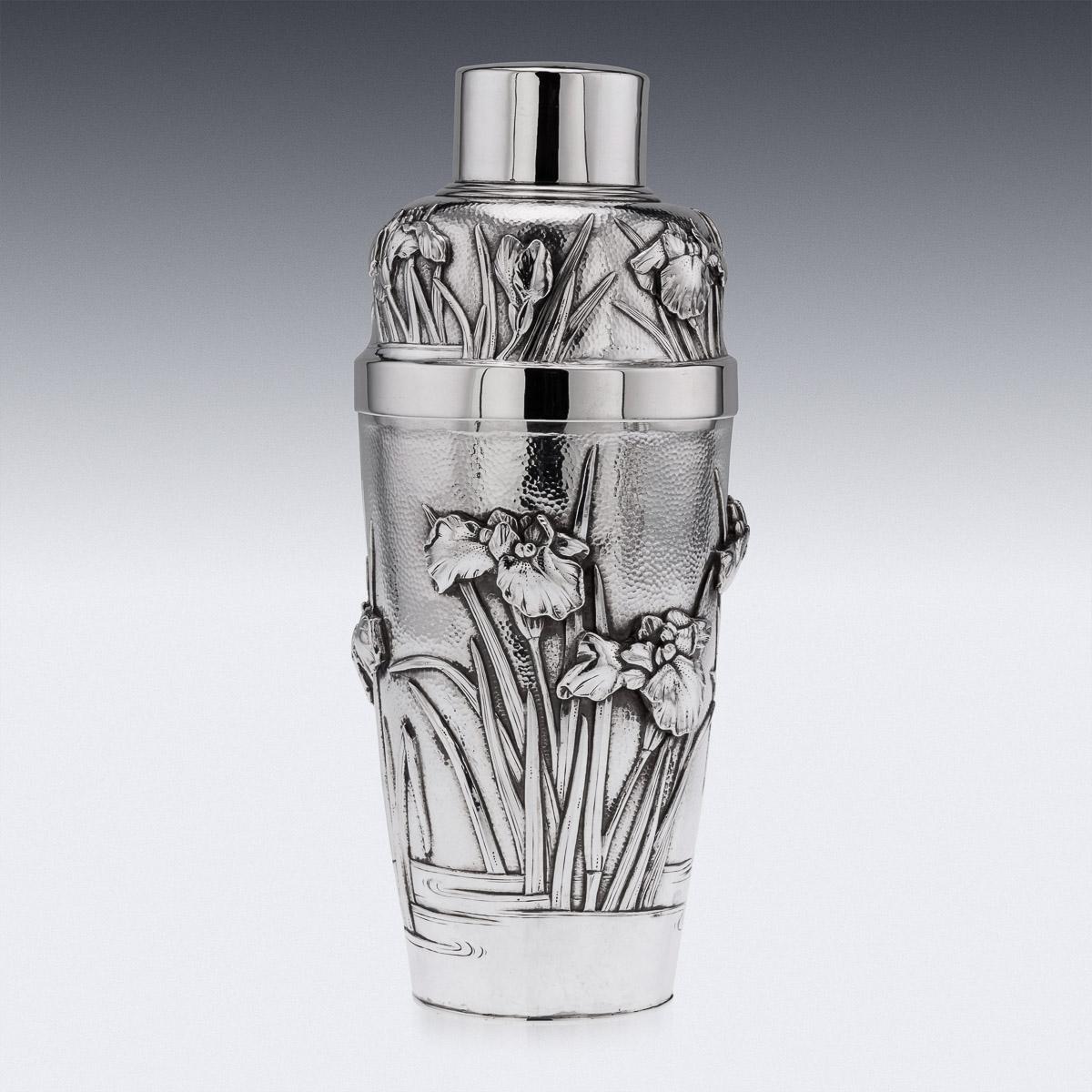 20th Century Japanese Meiji period silver cocktail shaker and four cups, densely chased and embossed with blossoming irises on matted hand hammered ground. The base is Hallmarked Sterling, (used on items made for export, 925 standard), these marks