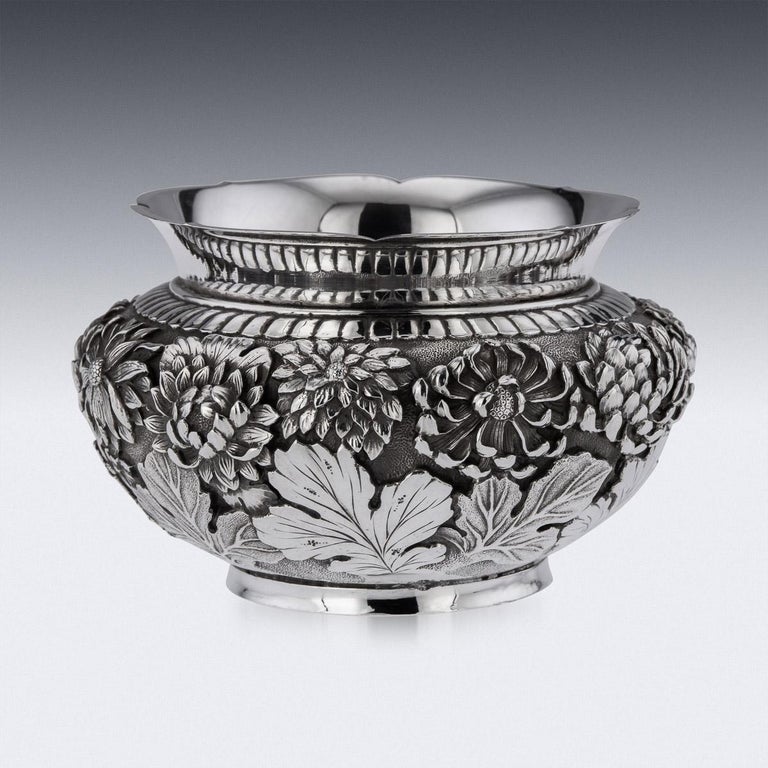 20th century Japanese Meiji period solid silver bowl, double walled, densely chased and embossed with blossoming irises on matted hand hammered ground, shaped floral rim and standing on a round shaped base.
Hallmarked with the “jungin”, meaning