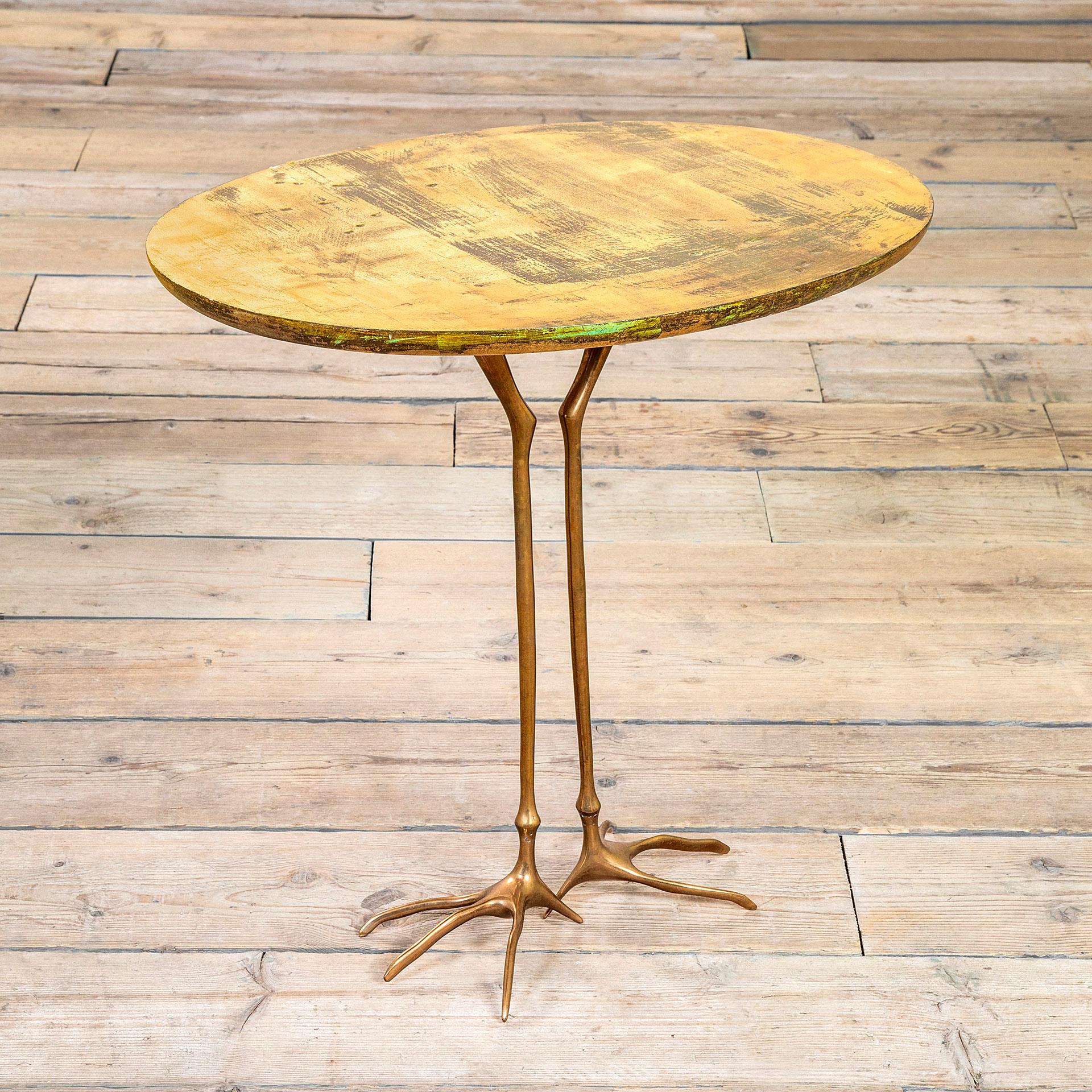 This table is a surrealist piece of furniture made while International Style was popular. Meret Oppenheim was a German-born Swiss artist and designer best known for her teacup lined with fur, now in the collection of the Museum of Modern Art.