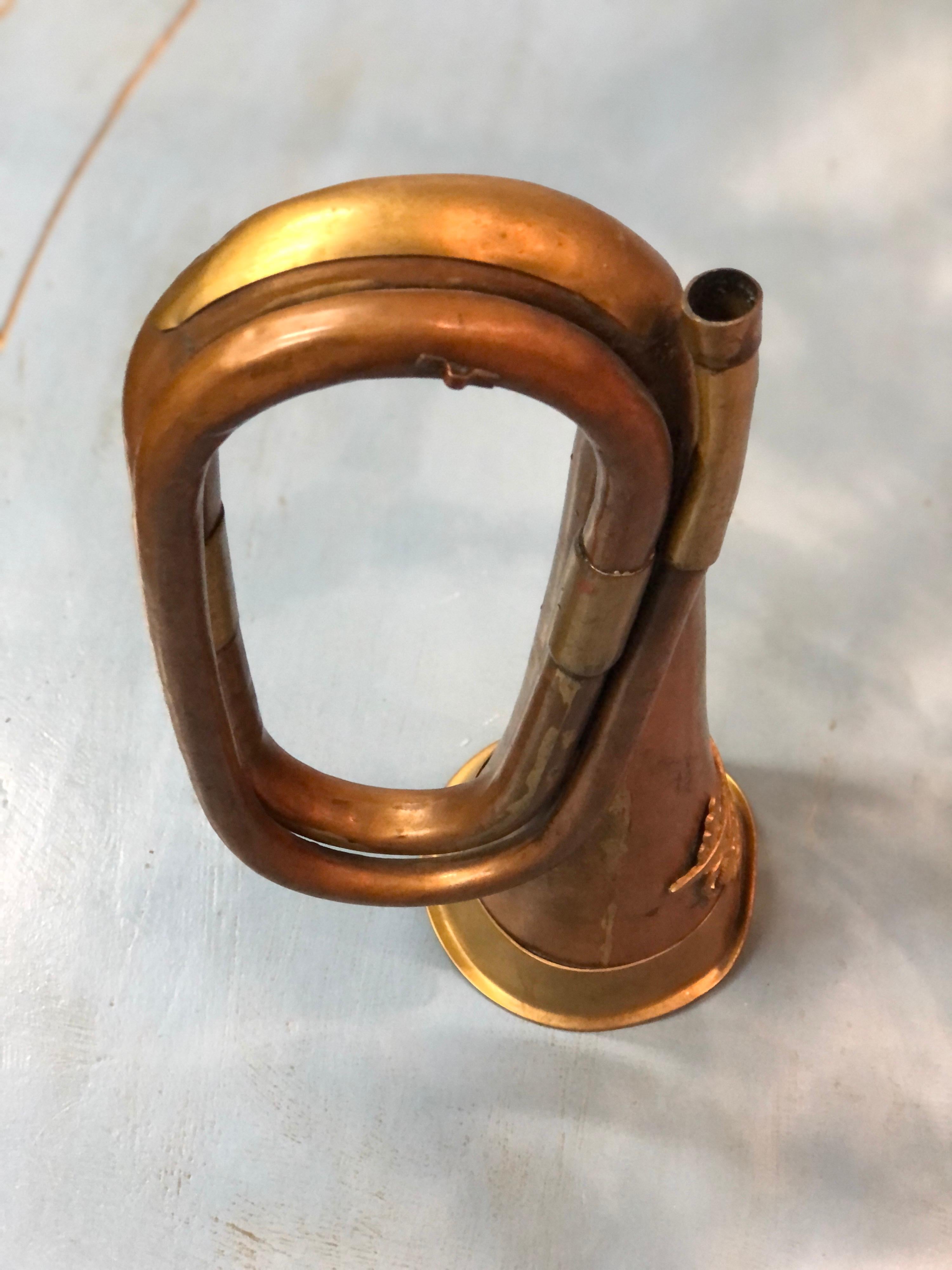 Small French military bugle made of brass and copper with missing mouthpiece.
France, circa 1900.