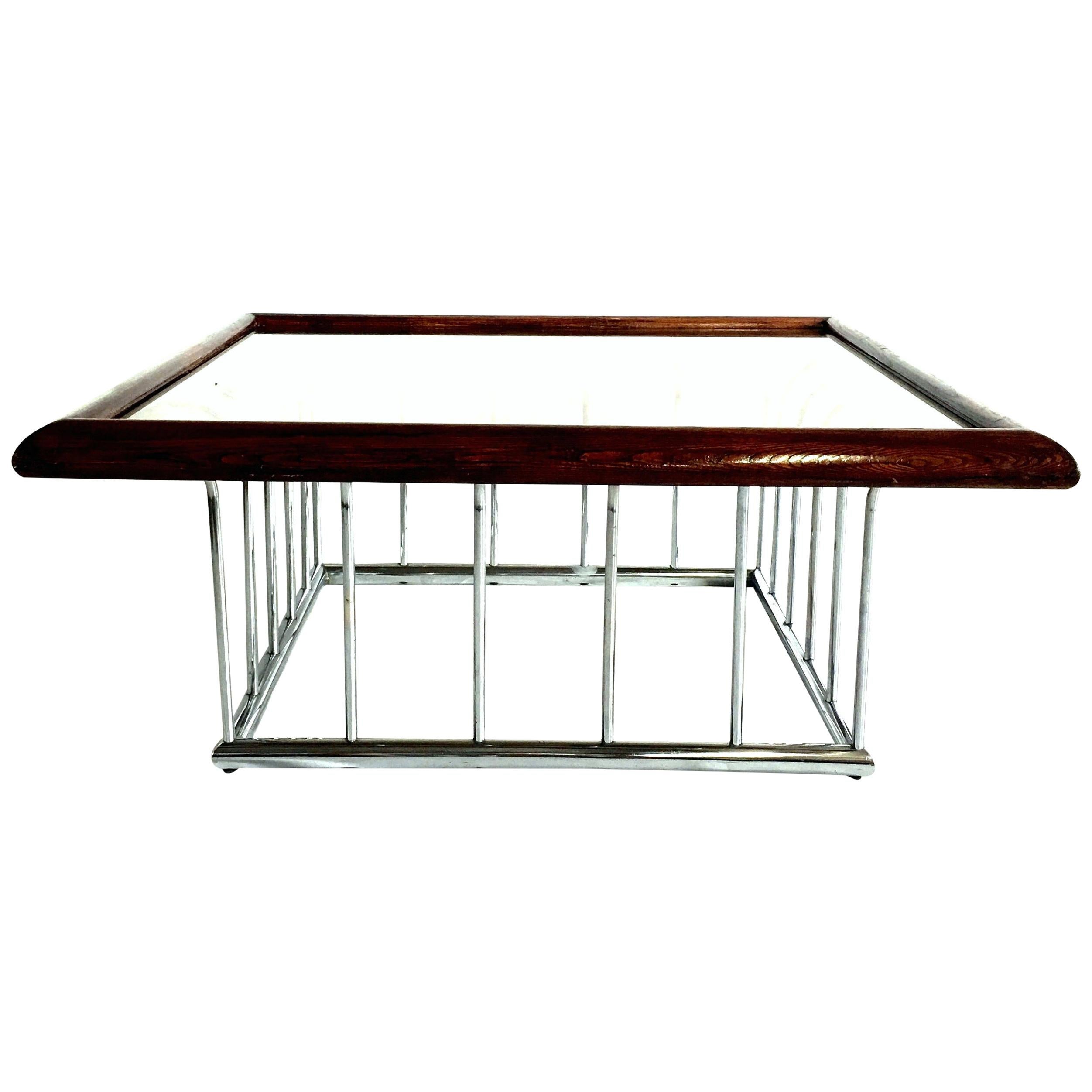 Mid-Century Modern Milo Baughman style bent tubular chrome spoke base square coffee table with wood stained mahogany edge and original smoked glass top. Size approximately 40