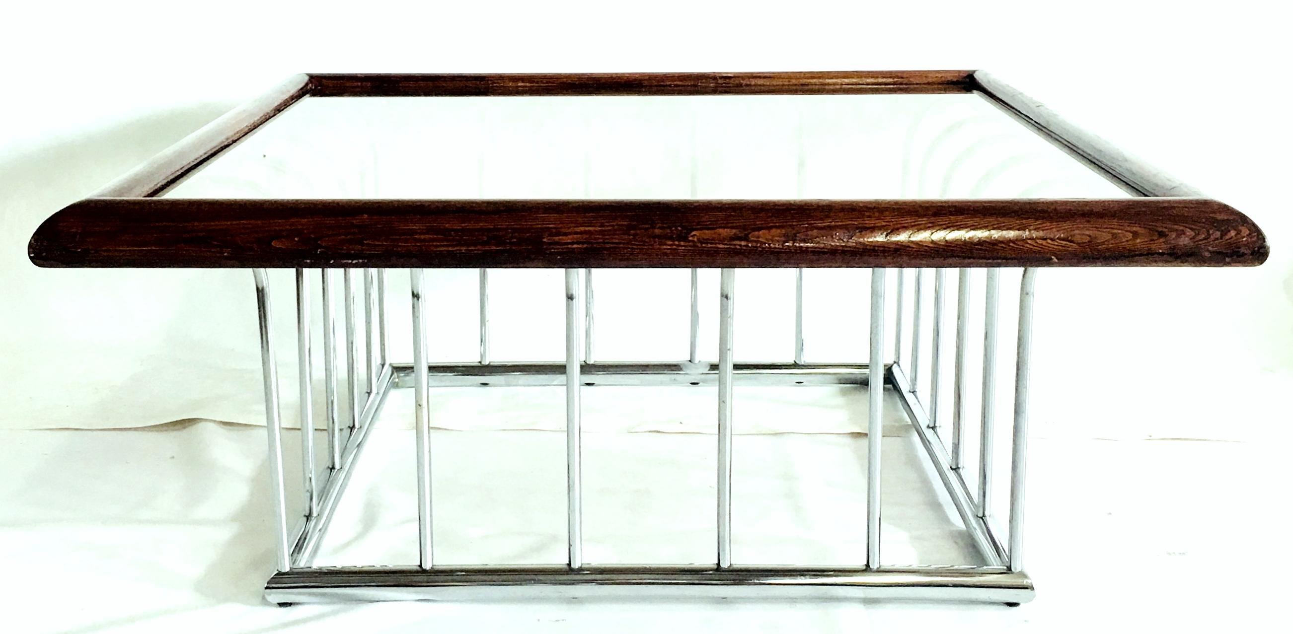 Mid-Century Modern Milo Baughman style bent tubular chrome spoke base coffee table with wood stained mahogany trim and original smoked glass top.
