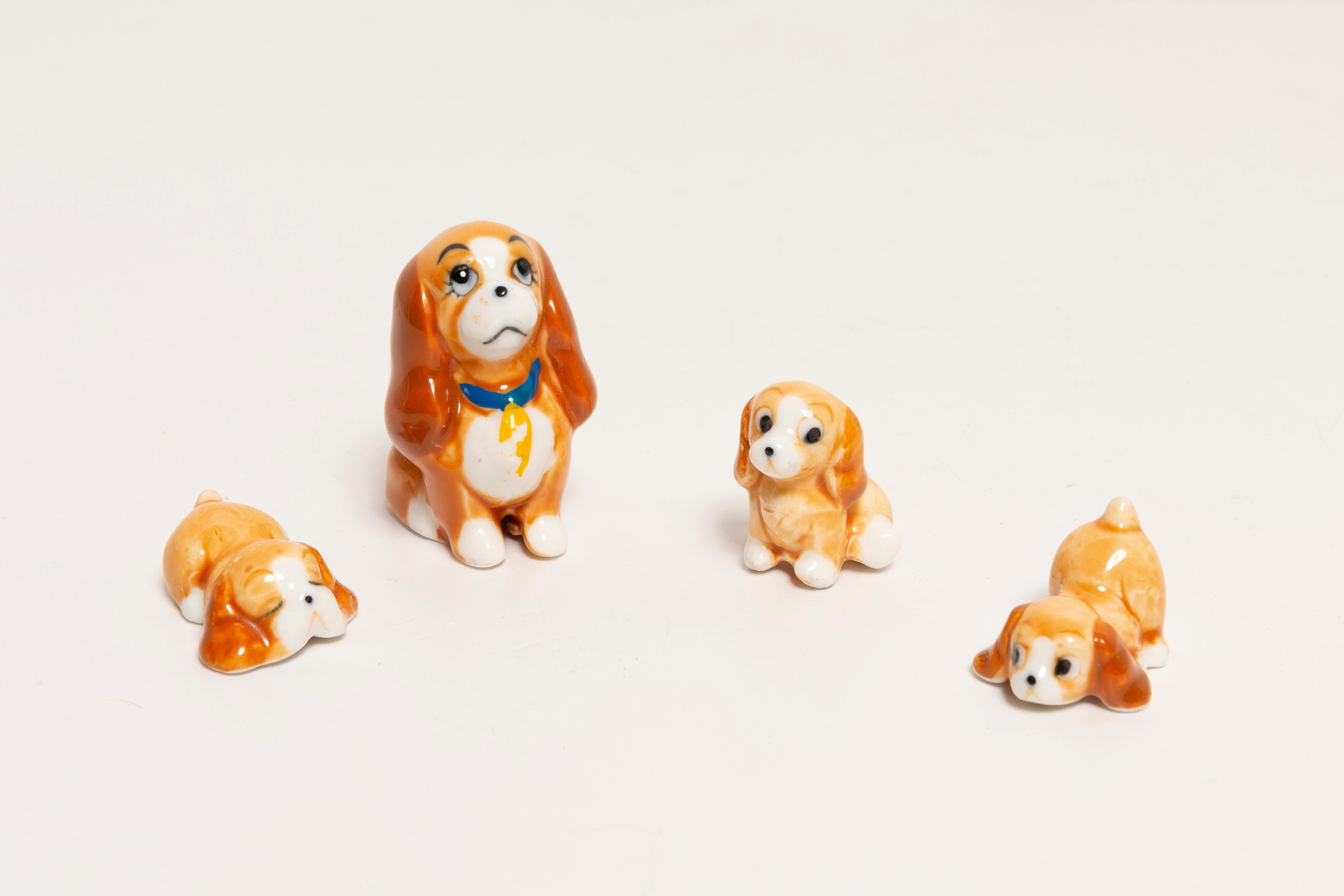 Painted ceramic, very good original vintage condition. No damages or cracks. Beautiful and unique decorative sculpture. Mini Spaniel Dogs Sculpture was produced in Italy. Only one set available. They are really small! Mommy-3 x 4 cm, babies-1 x 2 cm.
