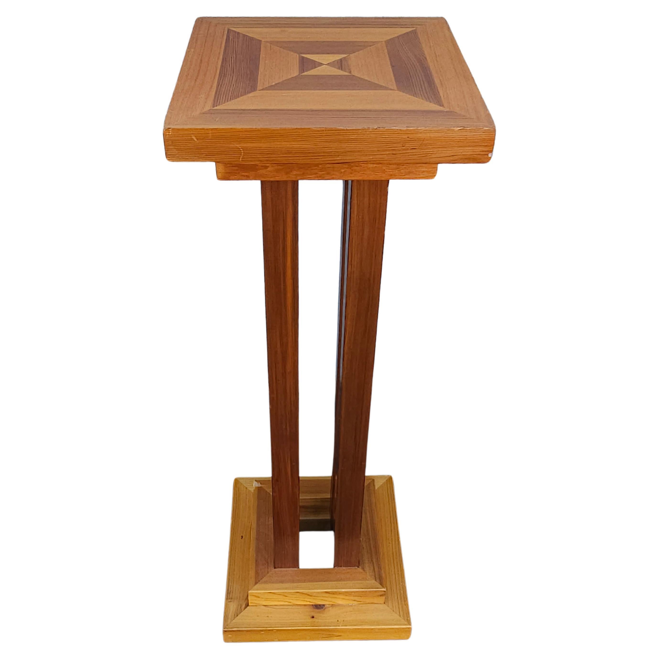 A 20th Century Mixed Fruitwood Parquetry Plant Stand measuring 11