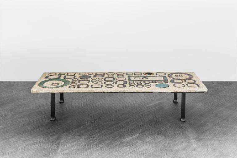 One of the kind master piece by the ceramicist couple Andrée & Michel Hirlet: Rare coffee table made of concrete inlaid with enameled stoneware elements creating a geometric pattern that recall in significant ways the iconic aesthetic of the 70's