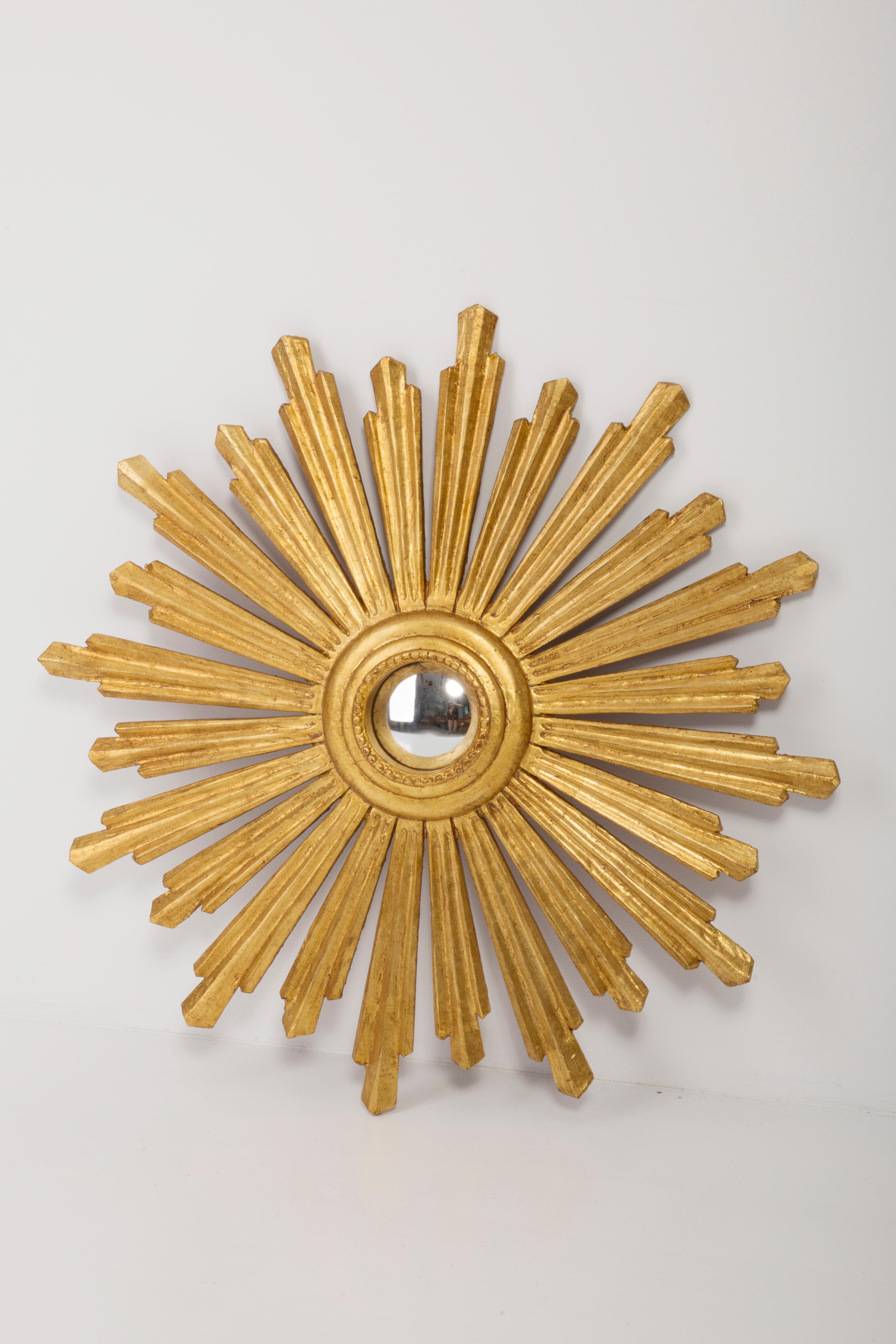 A fish-eye mirror in a golden decorative sun-shaped frame from Italy. The frame is made of wood. Good condition, no damage or cracks in the frame, the mirror pane has minimal flaws. Beautiful piece for every interior! Absolutely unique. Mirror size: