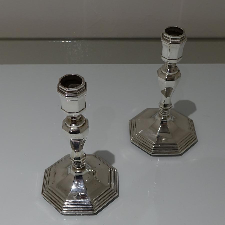 A stylish pair of modern silver octagonal formed cast candlesticks designed with outer “stepped” bases for lowlights and elegant curvaceous stems.

 

Weight: 20.6 troy ounces/641 grams

Measures: Height 6.41 inches/16.5cm

Diameter 3.75