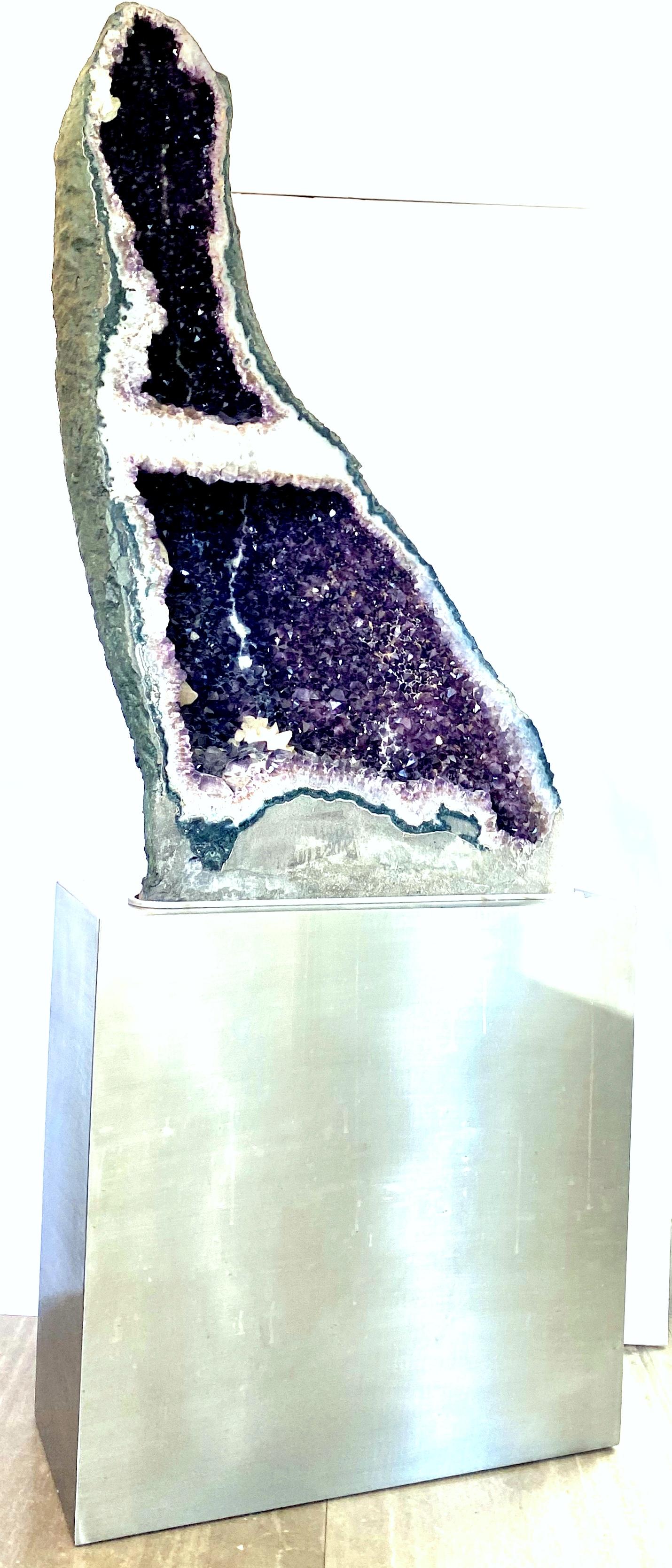 20th century monumental museum quality Brazilian cathedral amethyst geode crystal with custom stand. This one of a kind natural amethyst geode measures just over three feet in height. Features brilliant deep fully pointed consistent purple crystals,