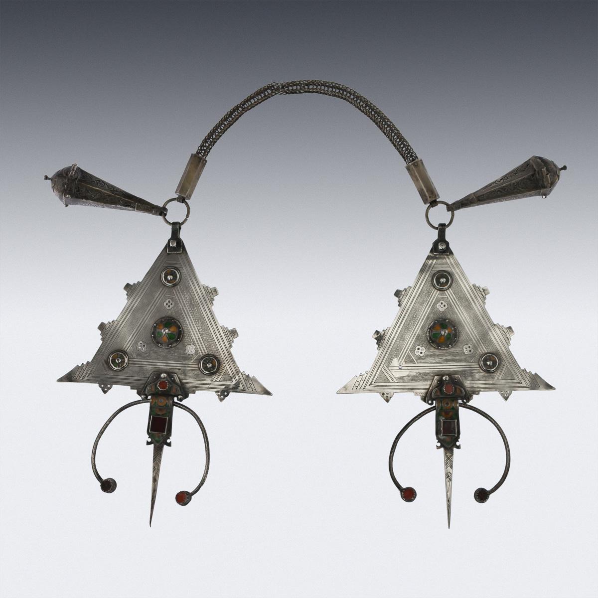 Antique early 20th century rare Moroccan (Tiznit, Atlas mountains) silver and enamel pair of fibulae (Cloak Fasteners), in the form of shaped triangles, tooled and applied with cloisonné enamel plates, the woven wire-work belt terminating with two