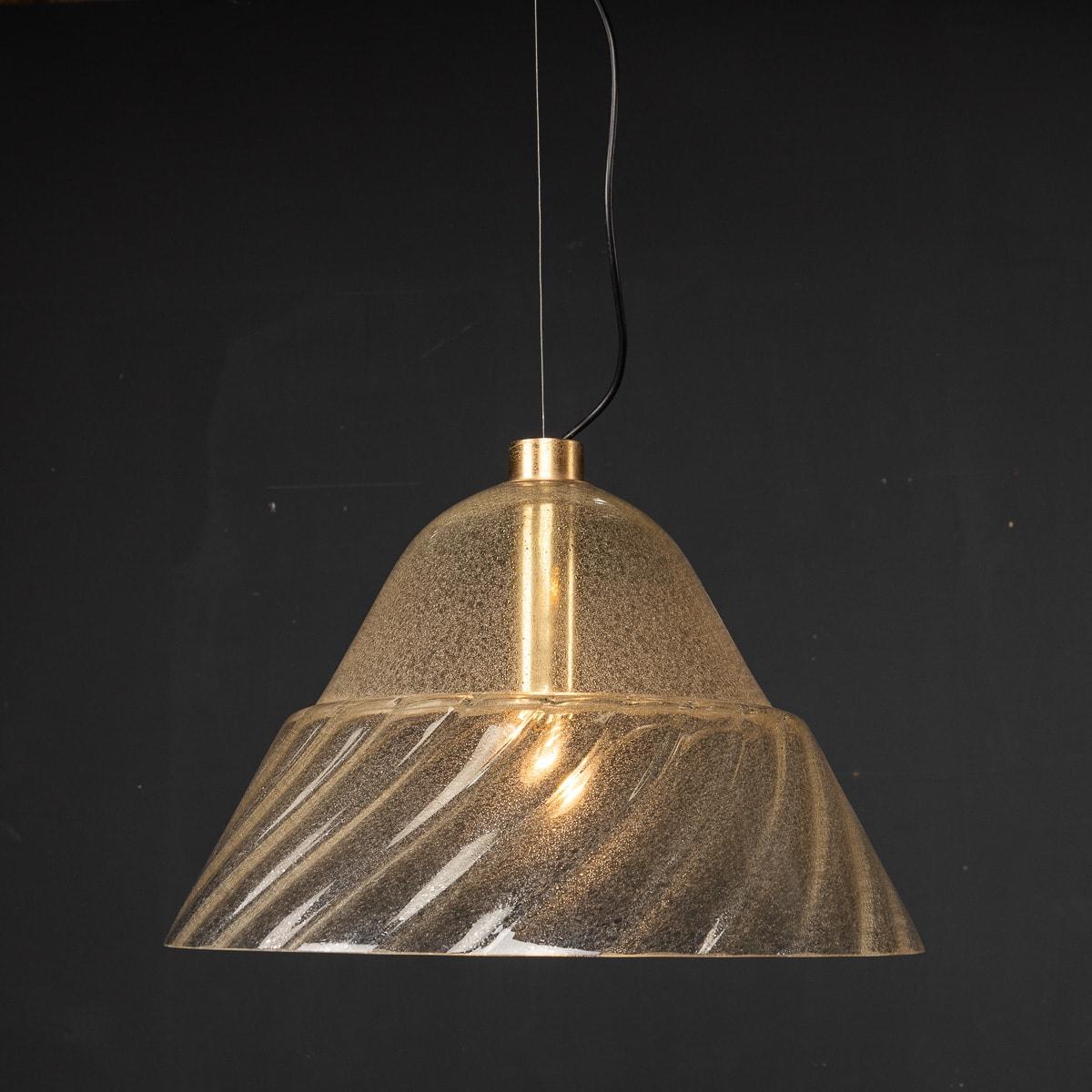 A large, beautiful pale amber colour Murano glass pendant light created AVMazzega in Murano, Venice during the 1970s. The glass features a opulescent finish allowing a stunning refraction of light to burst around the room. 

CONDITION
In Good