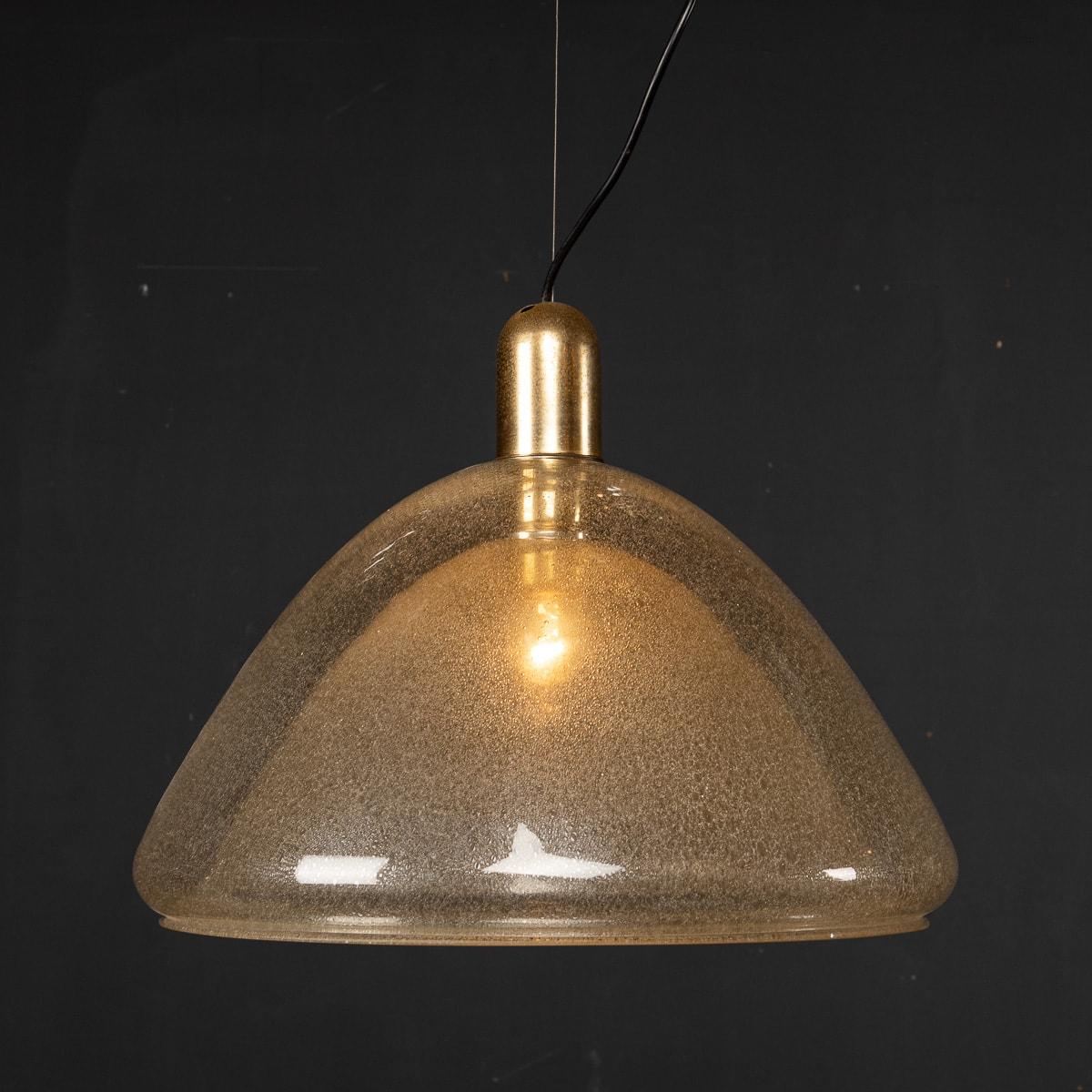 A large, AVMazzega pale amber Murano glass pendant light created in Murano, Venice during the 1970's. The glass features a opulescent finish allowing a stunning refraction of light to burst around the room. 

CONDITION
In Good Condition. (please