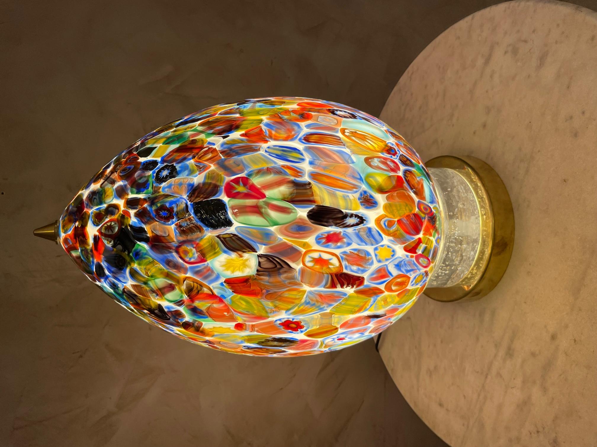 Exceptional Hand blown glass egg table lamp made by the talented Murano Craftsman. We can see different shape and color. 
A brass finish complete this amazing lamp. The base is made with blown glass and brass. This Egg lamp is exceptional and rare.