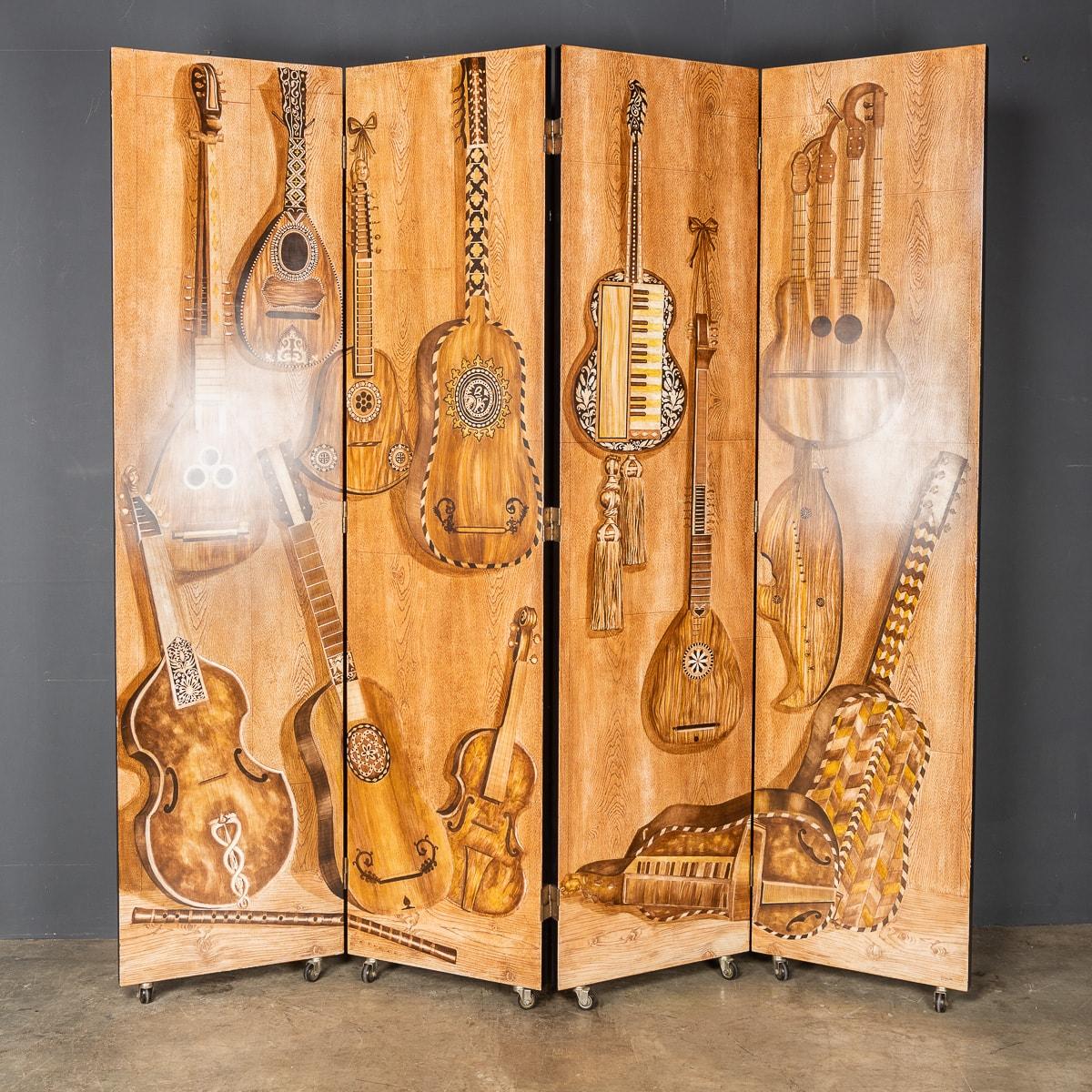A very rare musical folding screen by Fornasetti Studios made in Italy towards the latter end of the 20th century. Special edition of the famous strumenti musicali four fold screen by Fornesetti, first produced in the 1954, the screen with serial
