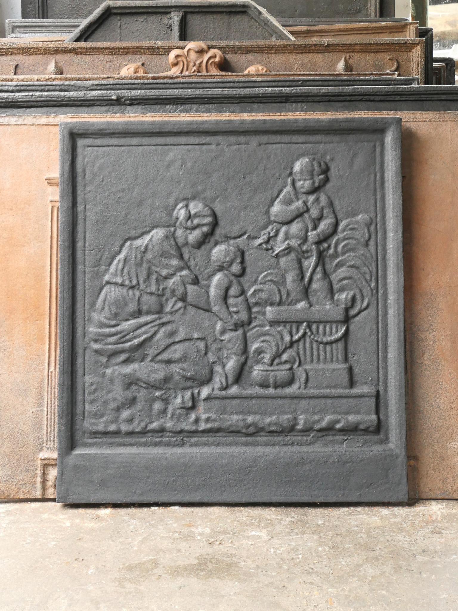 20th Century Napoleon Style 'Caritas' Fireback / Backsplash with the goddess Caritas. Caritas (the care / love). 'Love' from the triptych faith, hope and love, the three theological virtues. The fireback is made of cast iron and has a black / pewter