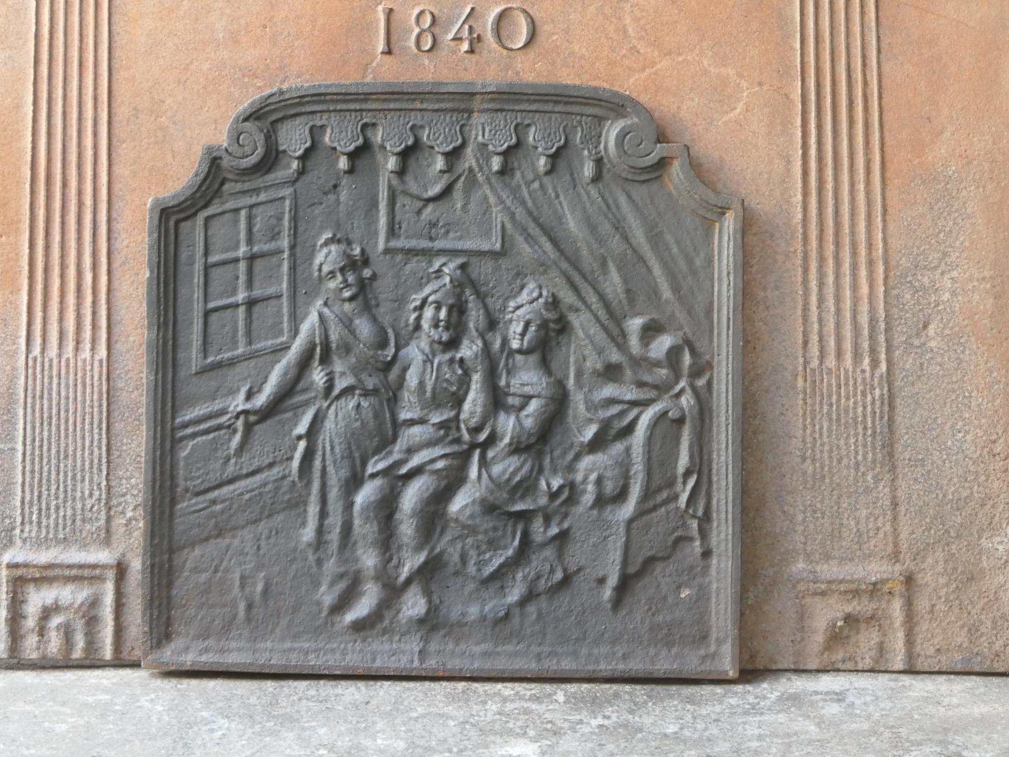 20th century French fireback with an unknown scene.

The fireback has a black / pewter color. It is in a good condition, without cracks.