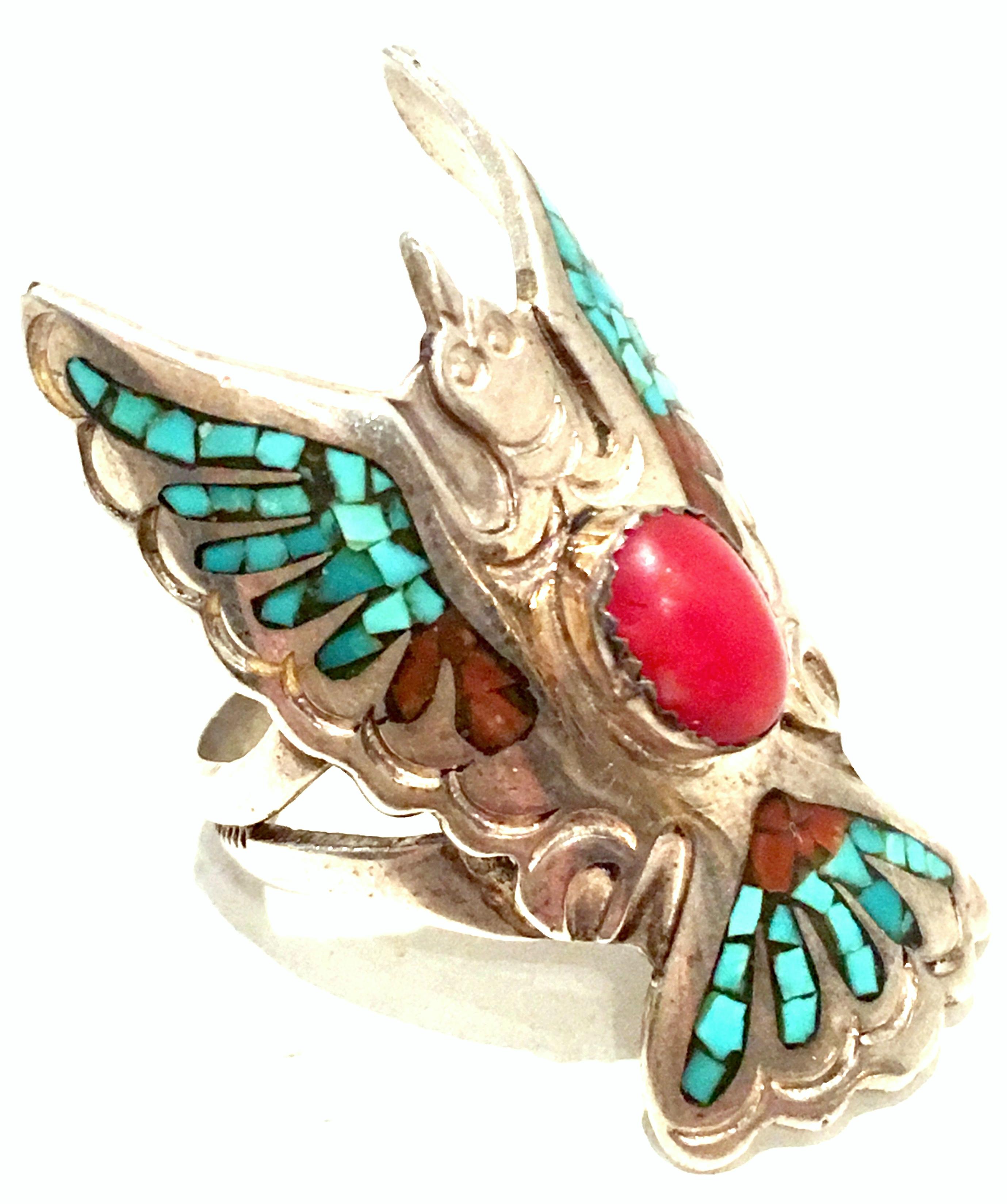20th Century Navajo Sterling Silver Turquoise & Coral Ring By, Loren Begay. This classic and timeless piece features 925 sterling silver with authentic turquoise and coral inlay stones with a central cabochon coral stone and a wrap around Eagle