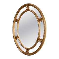 20th century neo-classical style tilted oval mirror by Deknudt, Belgium