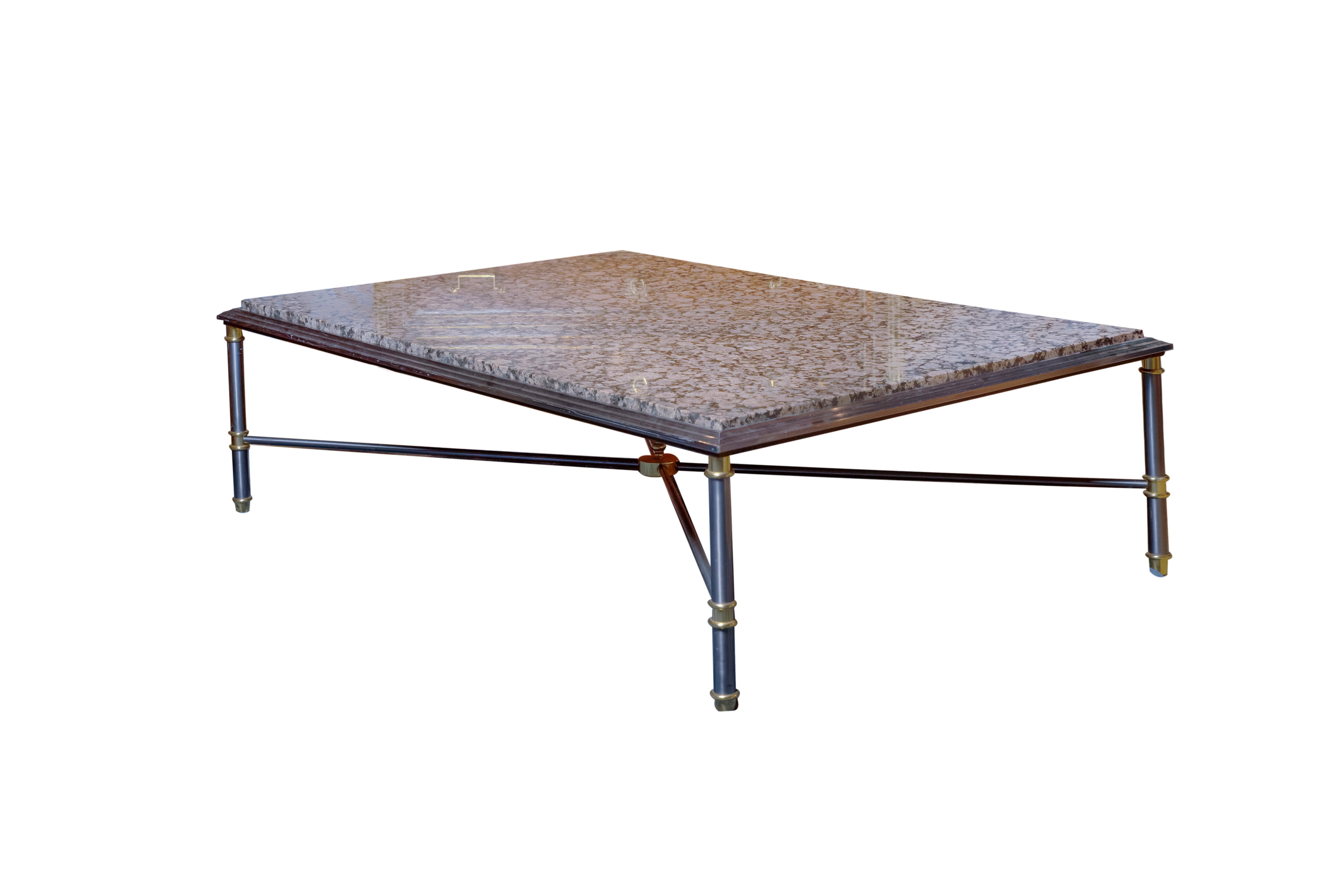 A 20th century neoclassical style coffee table or center table by Maison Charles. Four 