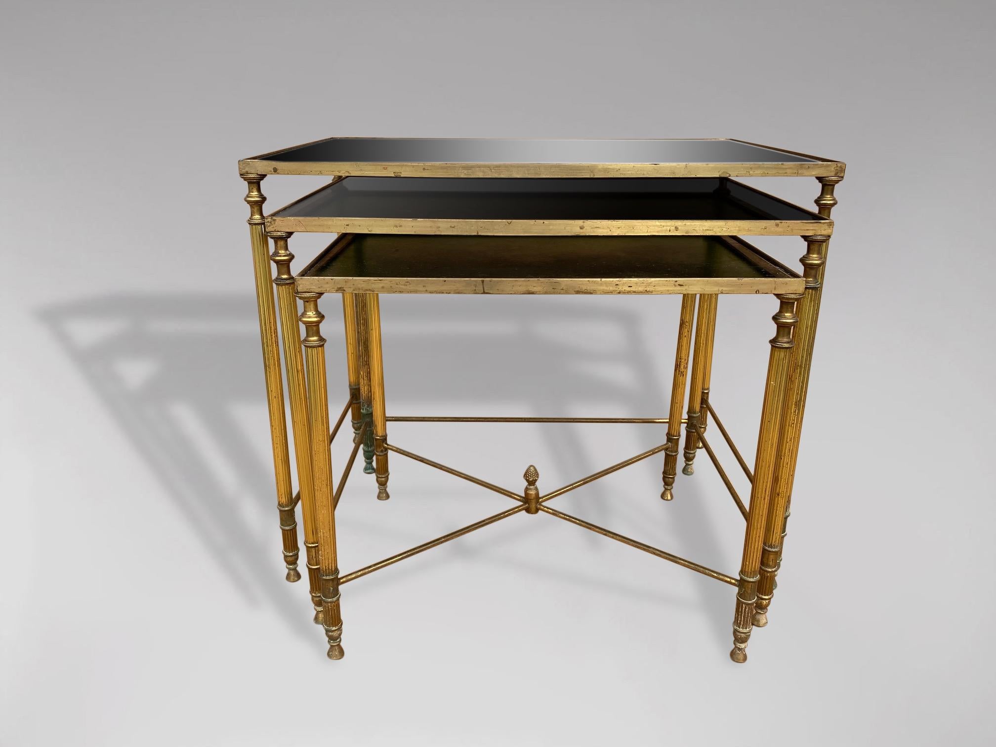 Hollywood Regency 20th Century Nest of 3 Brass Tables with Gold Leaf Glass Tops