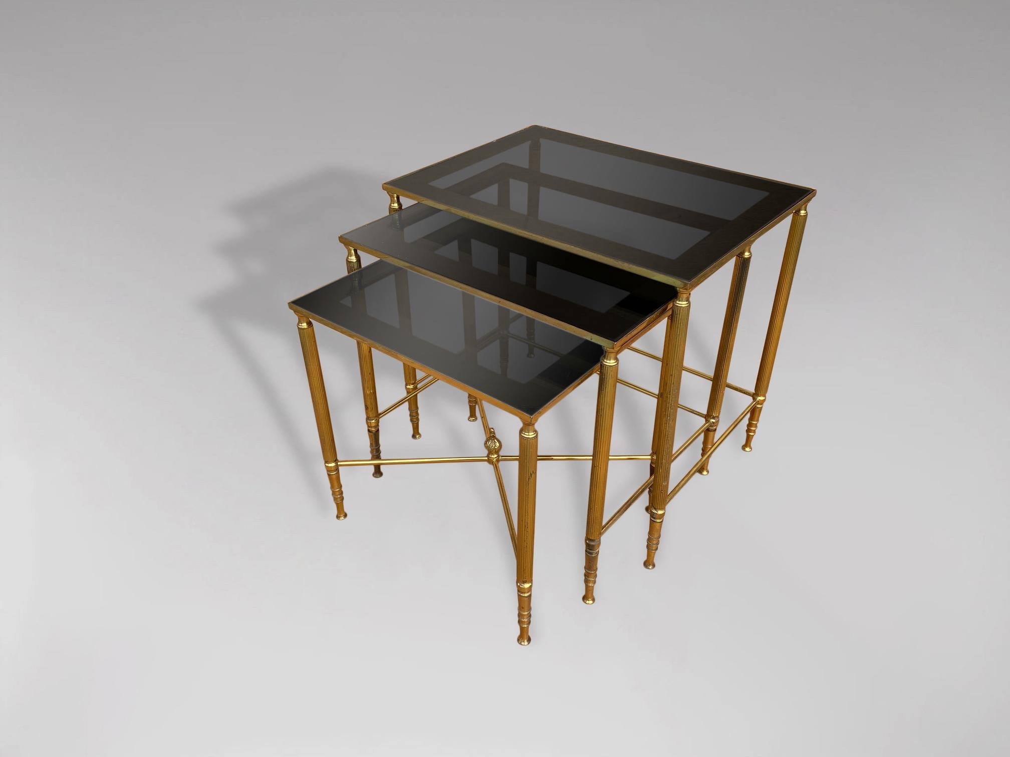 Hollywood Regency 20th Century Nest of 3 Brass Tables with Smoked Glass and Mirror Frame Tops