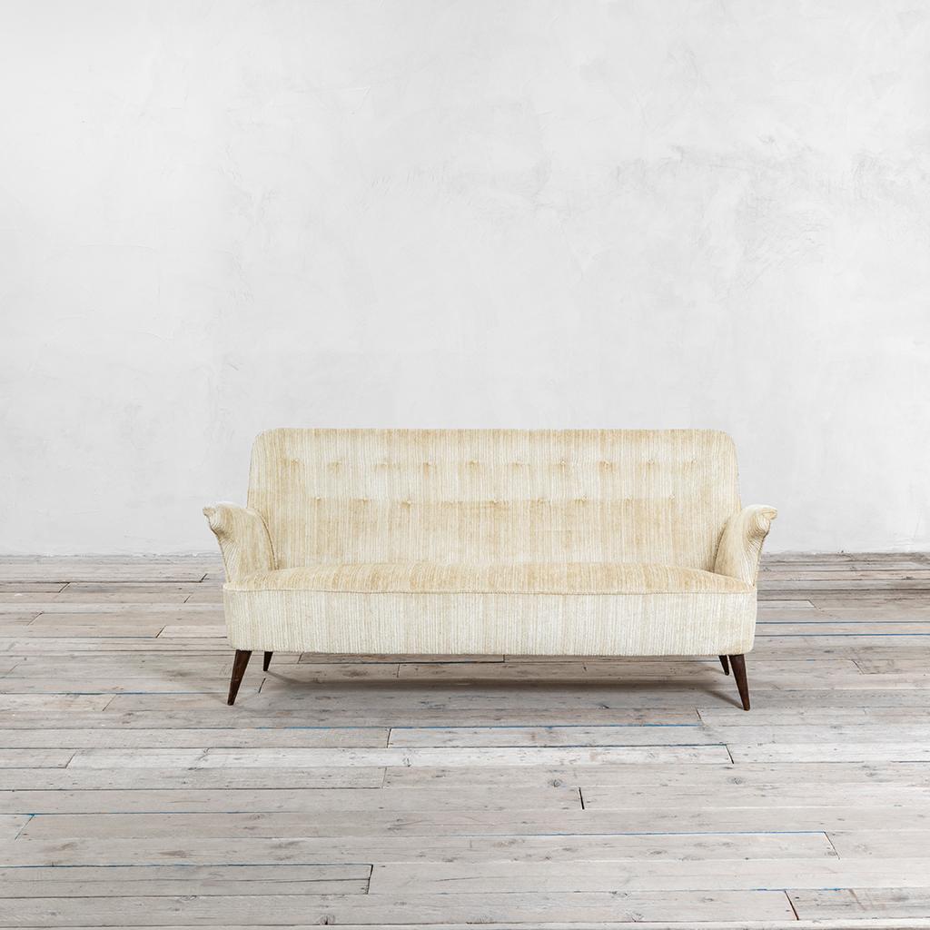 Sofa by Nino Zoncada in '50s. The sofa has a wooden structure and an off-white velvet upholstery. New upholstery. Very good condition, fully original.
Similar item published in: Domus n. 267, February 1952, pag. 16.
  