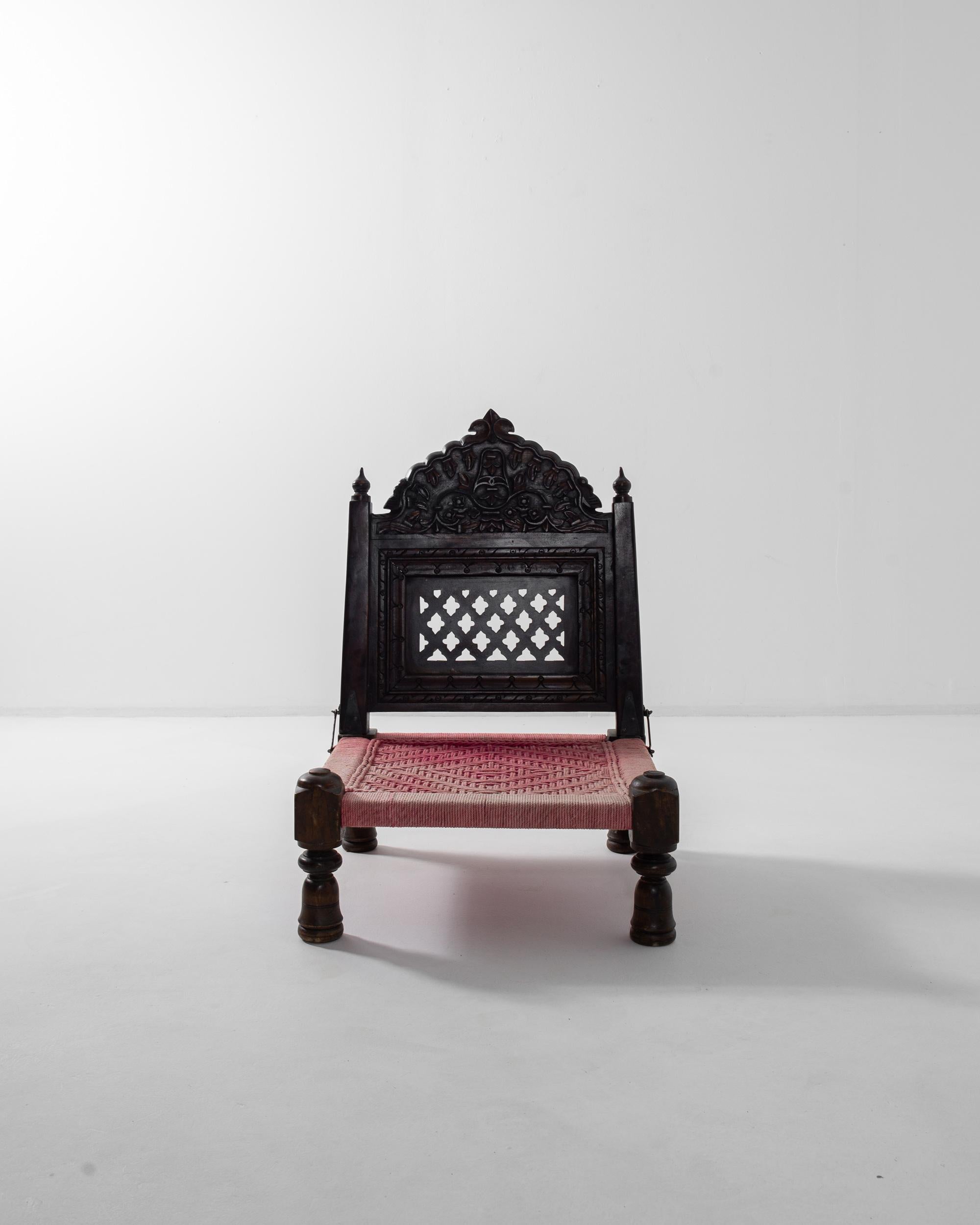 A beautifully ornate piece with a distinctive function, this vintage wooden berber’s chair is a truly unique find. Made in North Africa in the 20th century, the chair would have originally been used by ambulant berber people whose transient