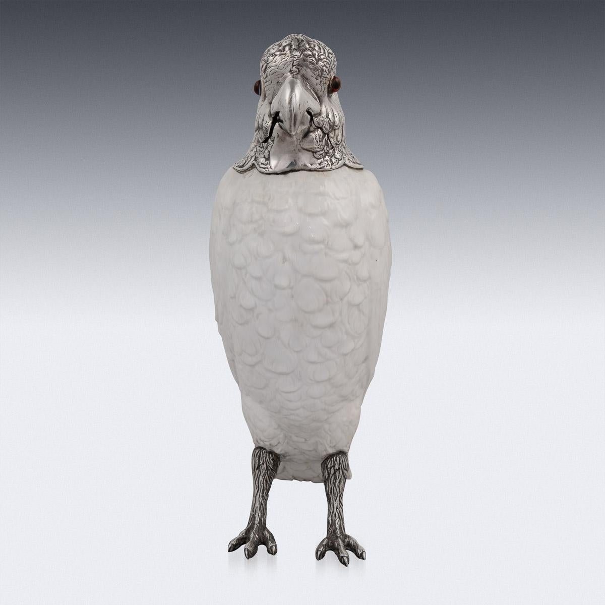 Antique early-20th century English solid silver and mounted on Spode Copeland's China novelty wine jug, in the form of a standing cockatoo, set with coloured glass eyes and white porcelain body imitating textured plumage, mounted with a
