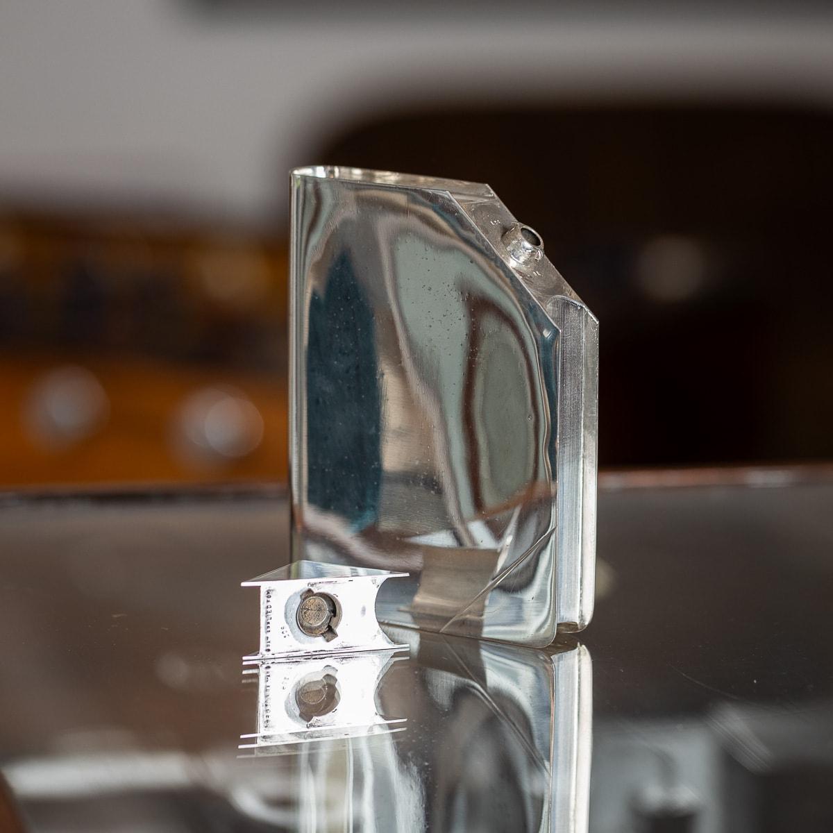A superb 20th Century silver plated book shaped hip flask, with a concealed twist lid. Made in France by the world famous brand, Hermès. Ingeniously designed, this object served a dual purpose – not only did it reflect the innovative spirit of its