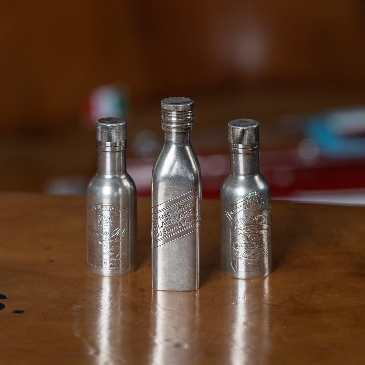 Modern 20th Century solid silver novelty Johnnie Walker whisky bottle. Of a miniature size however heavy gauge throughout. Rectangular form with a frosted finish throughout. Engraved with the label to represent a Johnnie Walker Black Label bottle.
