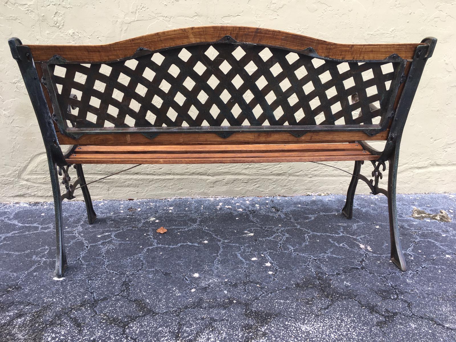 20th century oak and cast iron garden or park bench.