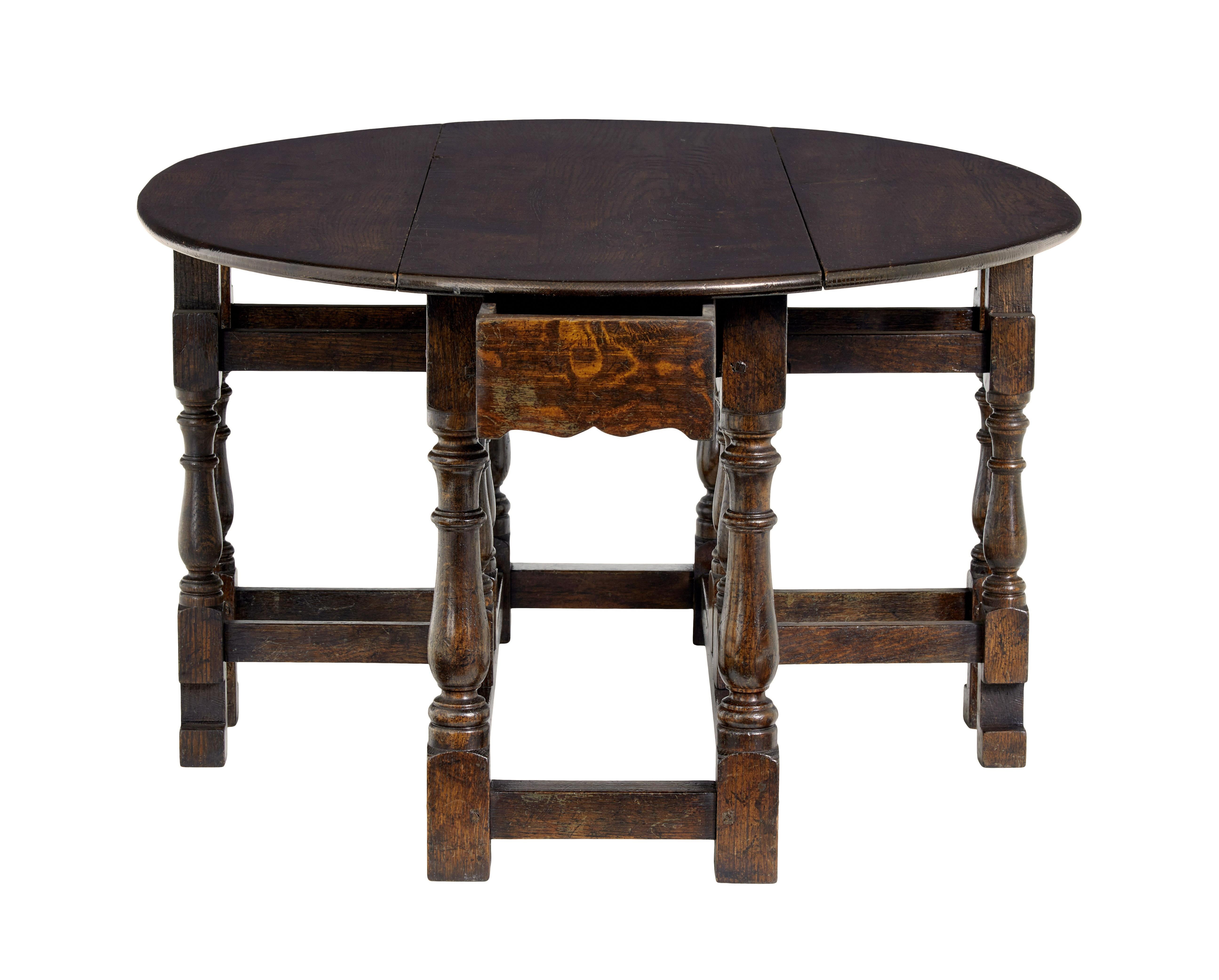 20th century oak Georgian style oak gateleg table circa 1990.

Good quality english made solid oak occasional / coffee table.  Made in the style of late georgian to early victorian rustic furniture.

Gateleg design which has been re-scaled into