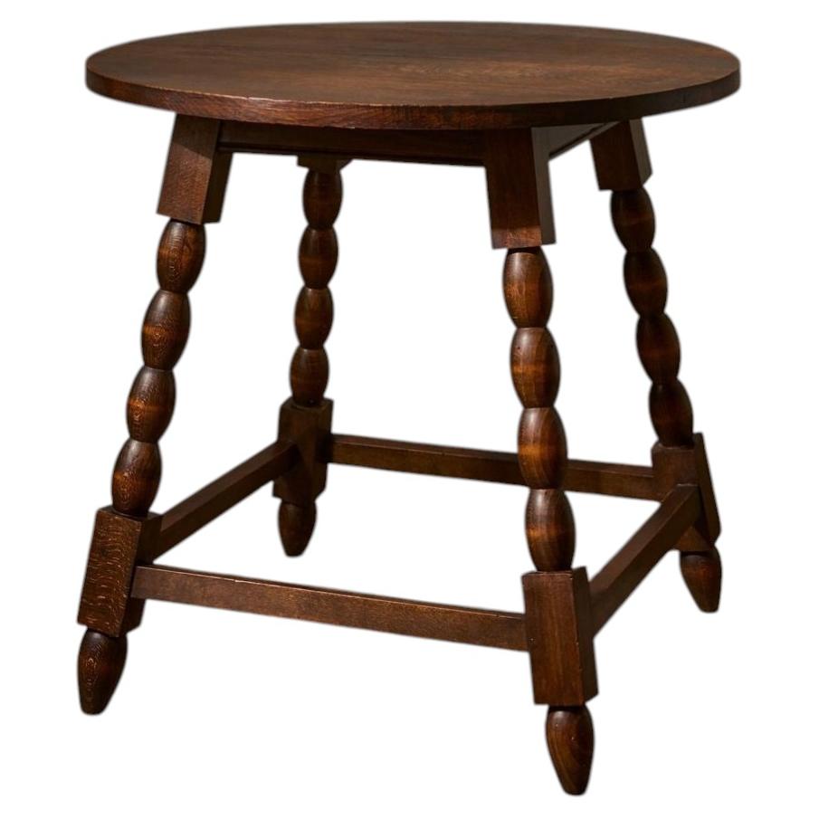 20th Century oak side table by Charles Dudouyt