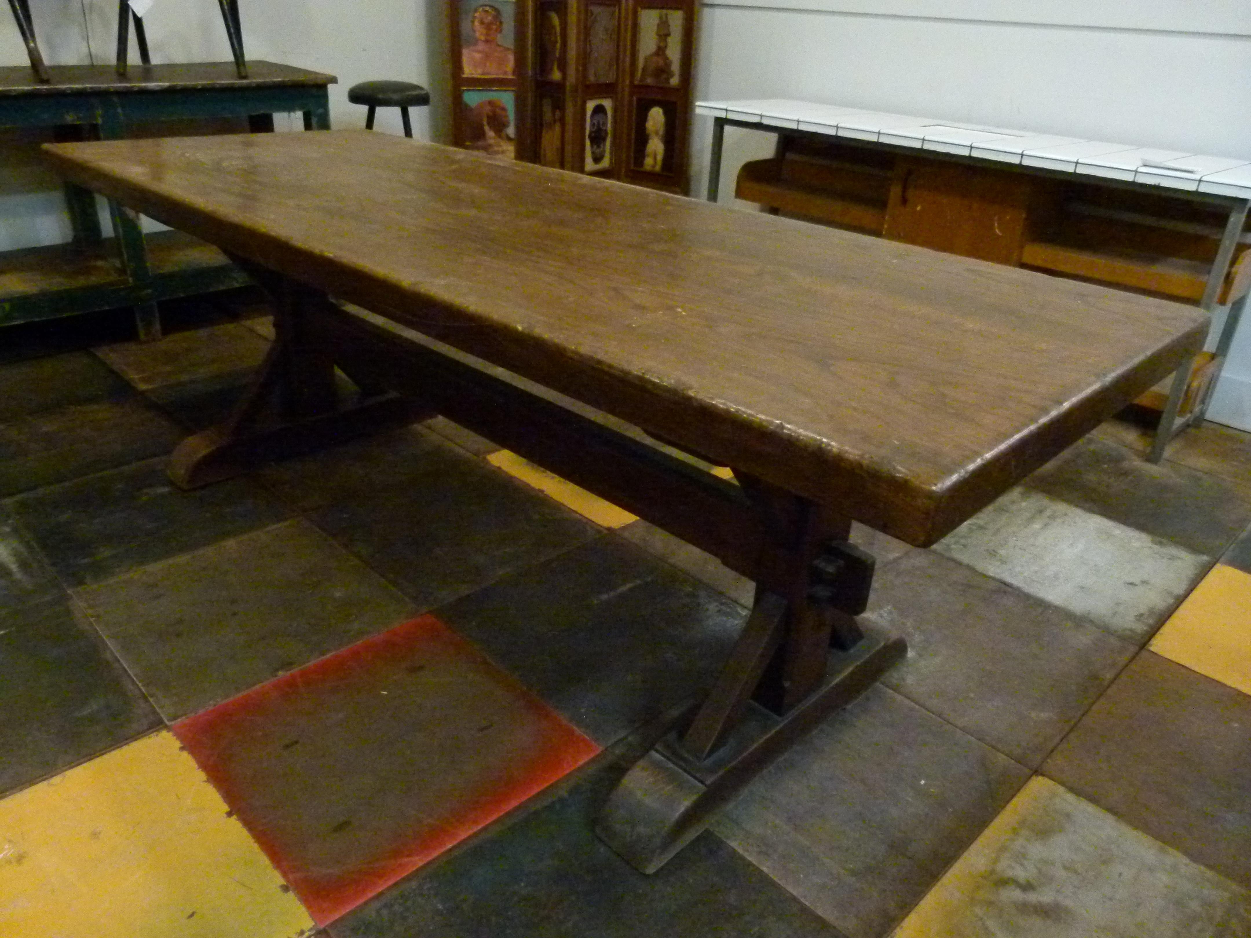 20th century oak table in monastery style in France. This design is very stable and robust.The solid base allows to sit comfortably since it gives enough room for the legs while sitting.