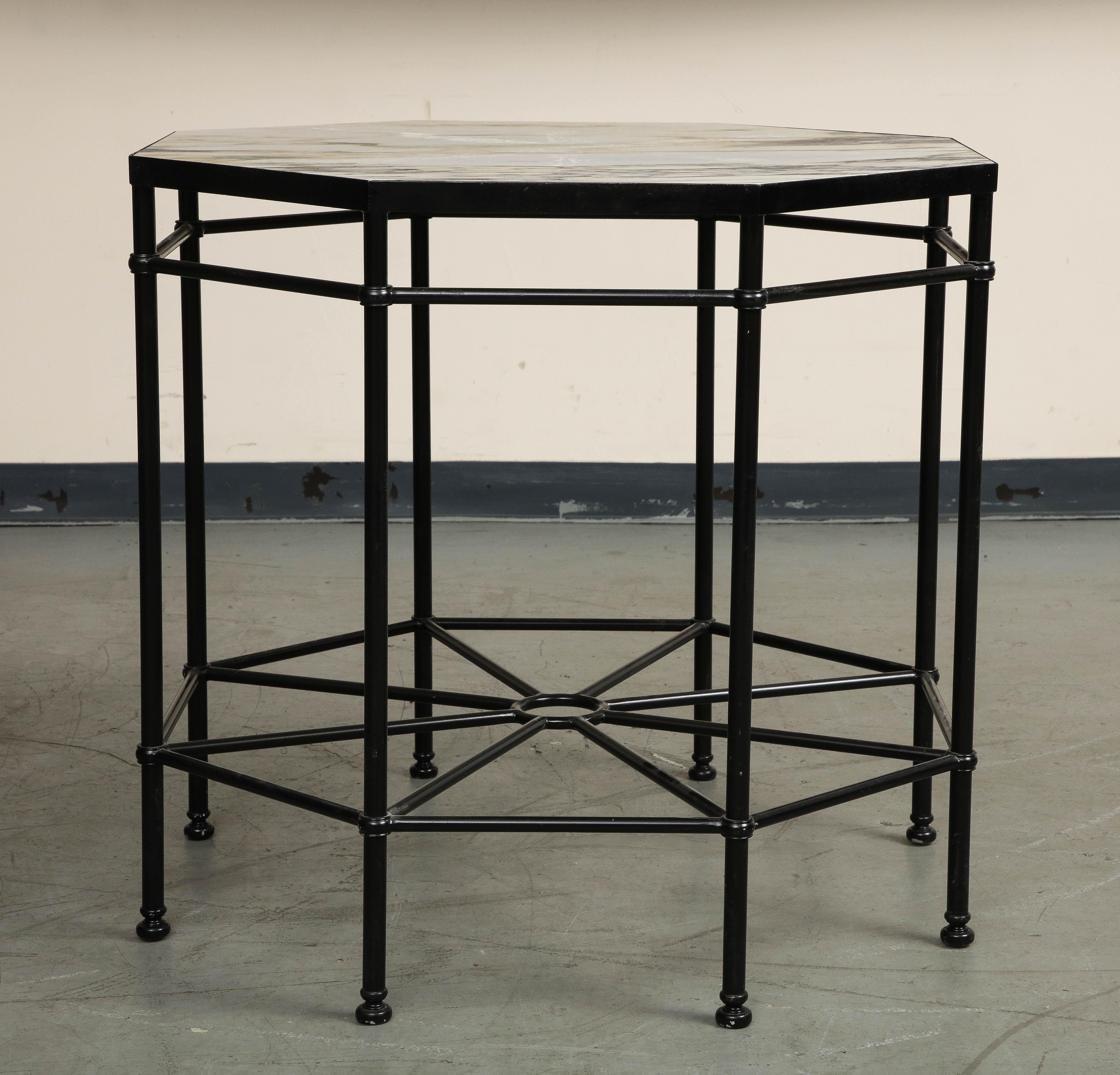 20th Century octagonal center table with a base of black painted steel and marble top, in the style of Theodore Alexander. Base stretchers meet with a spoke-and-wheel design. New inset top of Violetta marble custom made in 2022. 


