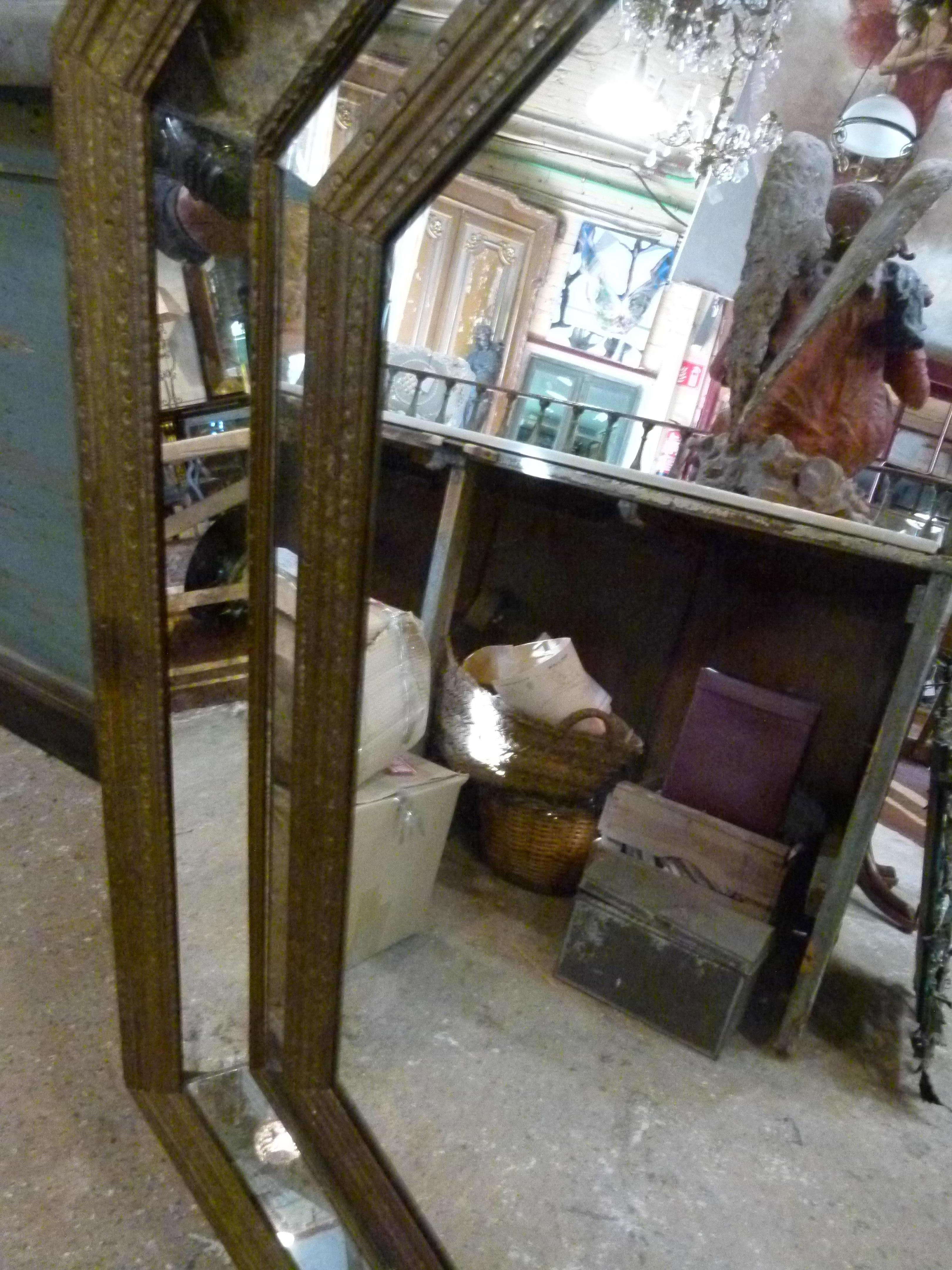 20th century octagonal shape iron double framed wall mirror. The mirror between the frames enhance perspective and volume to this piece, which makes it very special.

