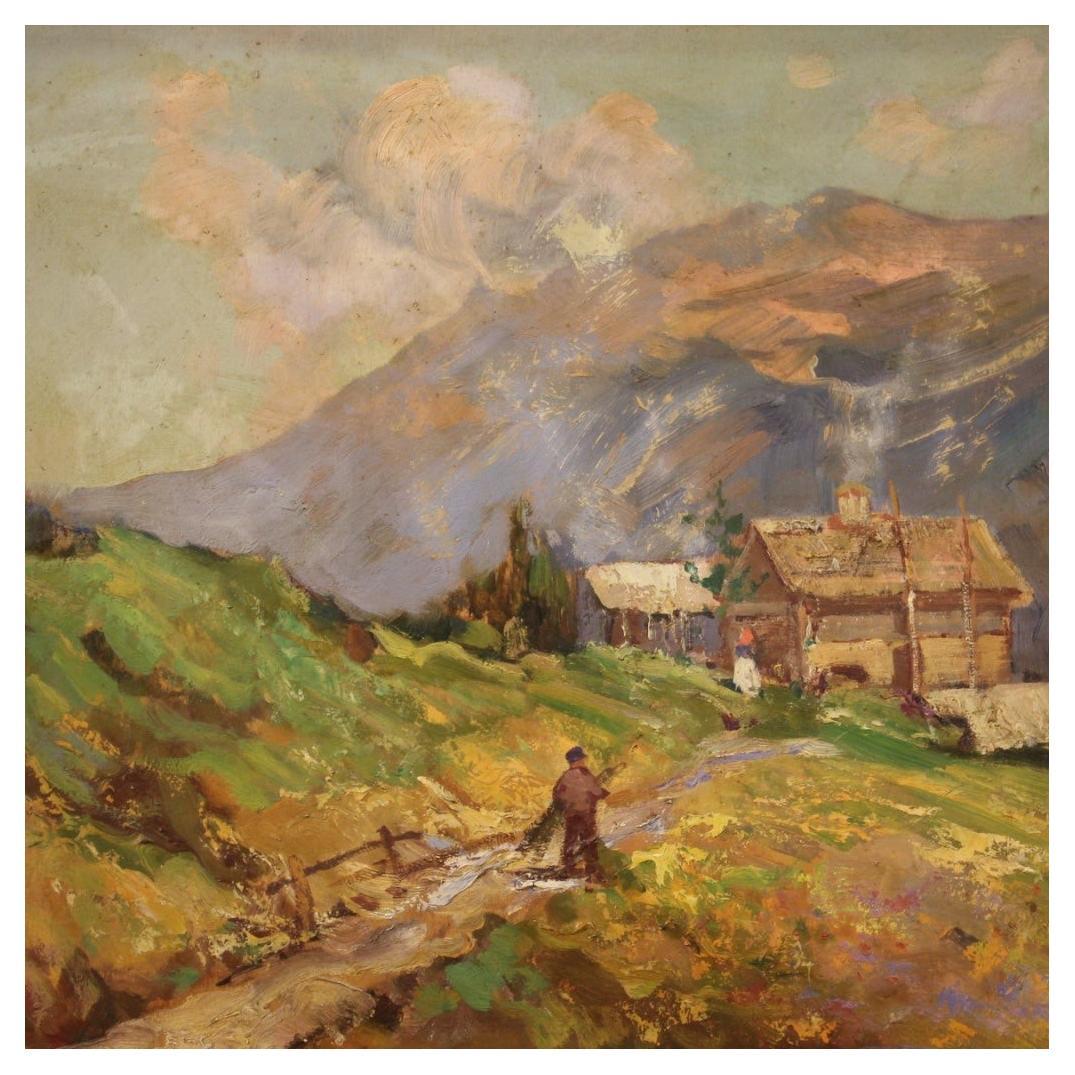 Italian painting from the mid-20th century. Artwork oil on board depicting a mountain landscape with a hut and characters in impressionist style of good pictorial quality. Small painting adorned with a wooden and plaster frame, carved, chiseled and