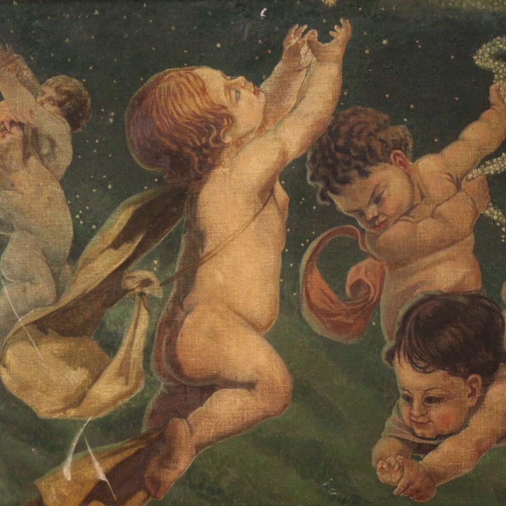 Italian painting from the middle of the 20th century. Framework oil on canvas depicting a game of putti on a starry sky of good pictorial quality. Modern frame in wood and plaster pleasantly chiseled and gilded of beautiful decoration. Painting of