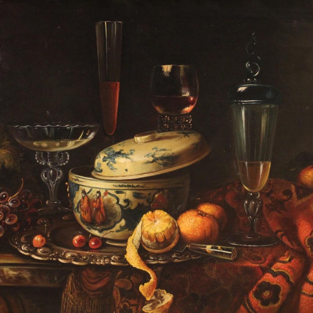 Great Italian painting from the second half of the 20th century. Oil painting on canvas in antique style of exceptional quality and dekor depicting rich still life on a dark background with fruit, ceramic and crystal goblets. Great impact painting
